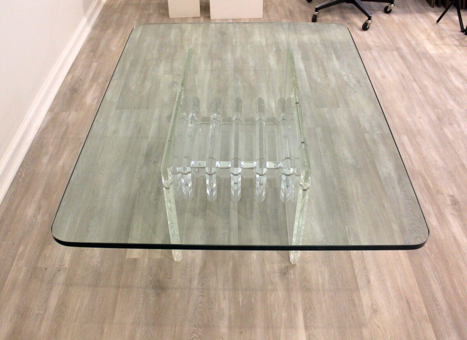 We presents this thick sculptural architectural lucite and glass rectangular coffee table. In very good condition. Dimensions: 48