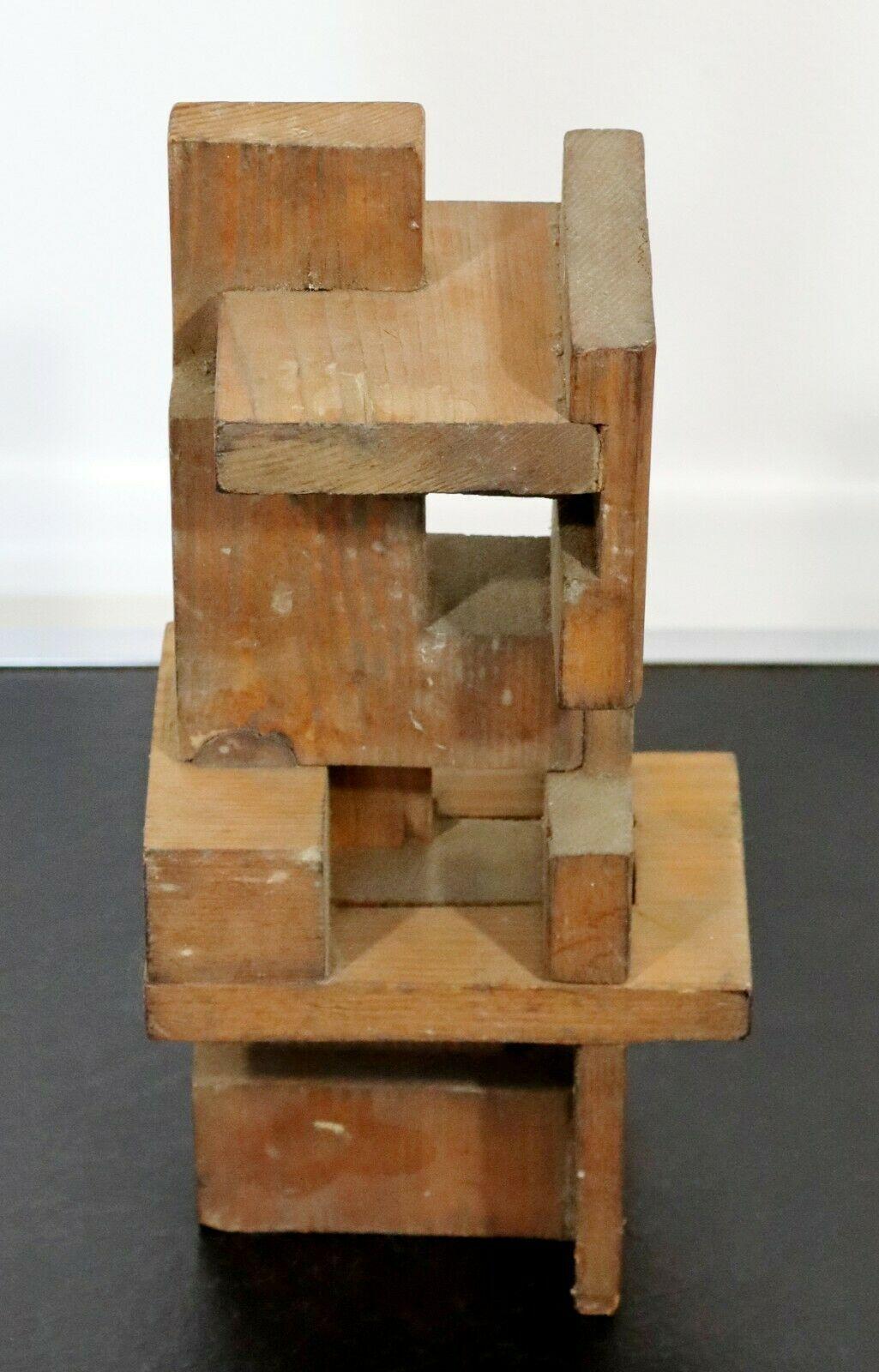 For your consideration is a captivating, constructivism, wood table sculpture by Charles Senseman. Seneseman studied at the world-renowned Cranbrook Institute.
 