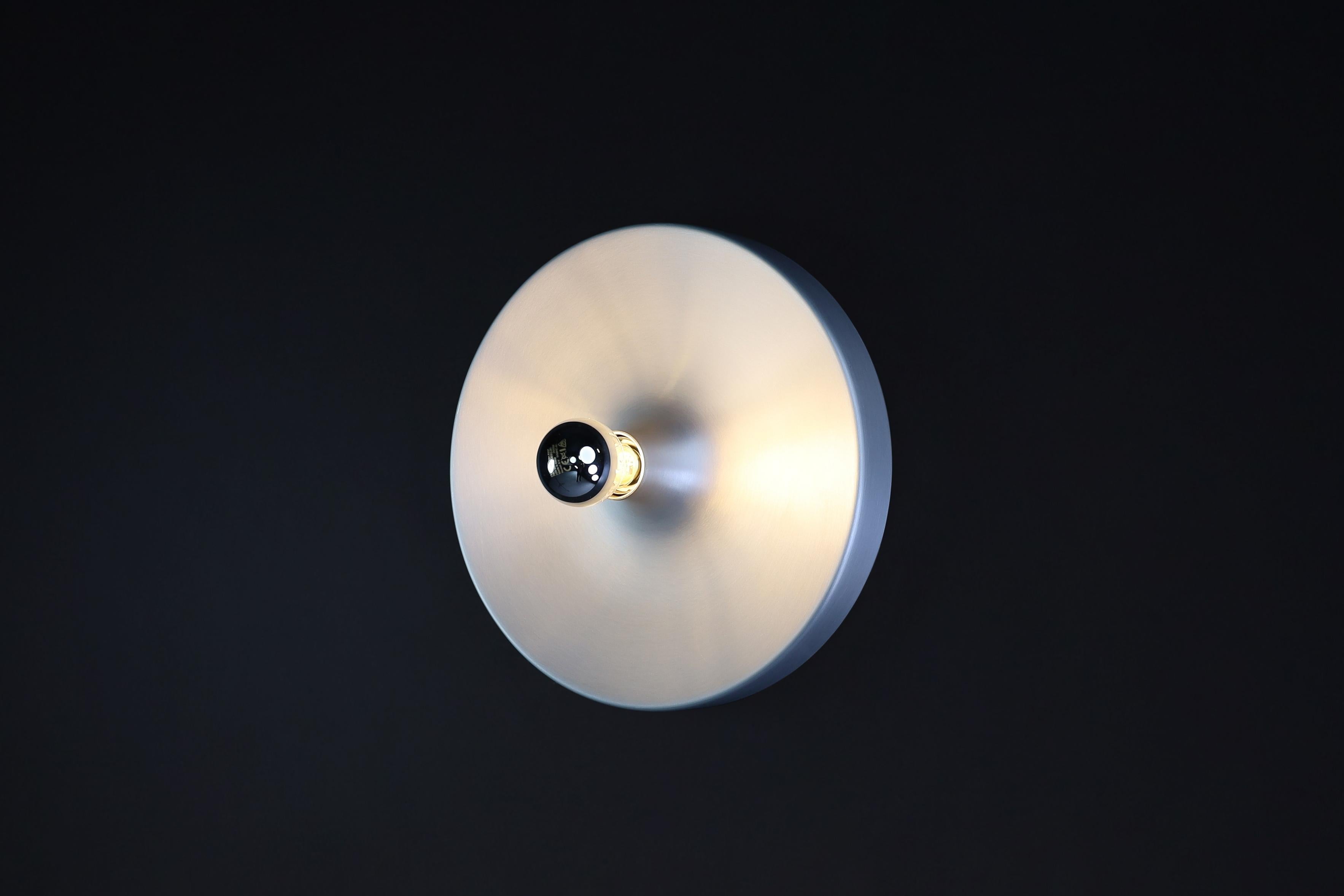 Charlotte Perriand Aluminum Disc Wall Lights, Germany 1960s

This collection of Charlotte Perriand Aluminum Disc Wall Lights is quite extensive. They were commissioned and handpicked by Charlotte Perriand herself in Germany during the 1960s. These