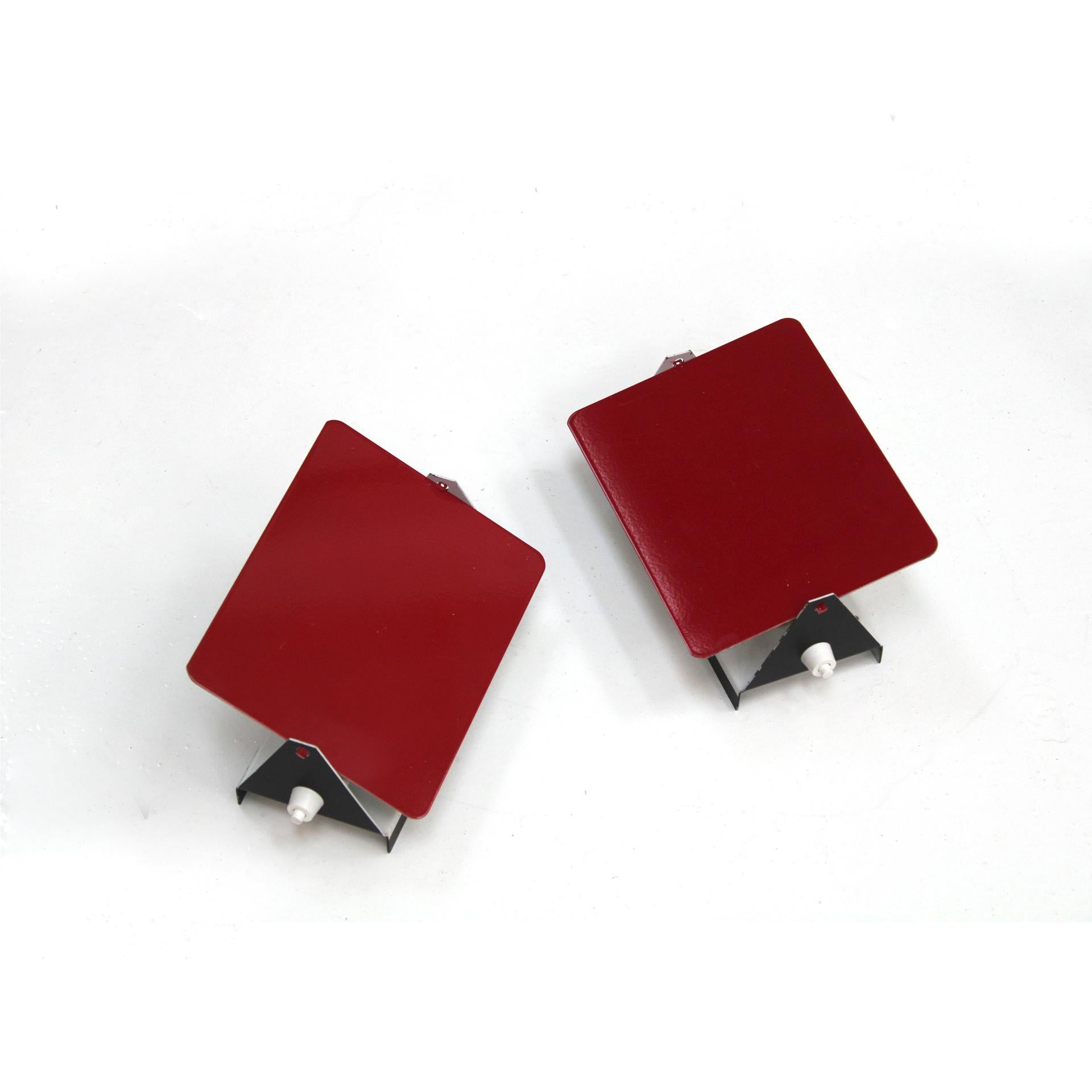 Set of twenty-four sconces designed by the iconic Charlotte Perriand for Steph Simon, circa 1960. These mid-century modern wall lights feature an adjustable main structure, allowing for flexible light redirection to perfectly illuminate any space.