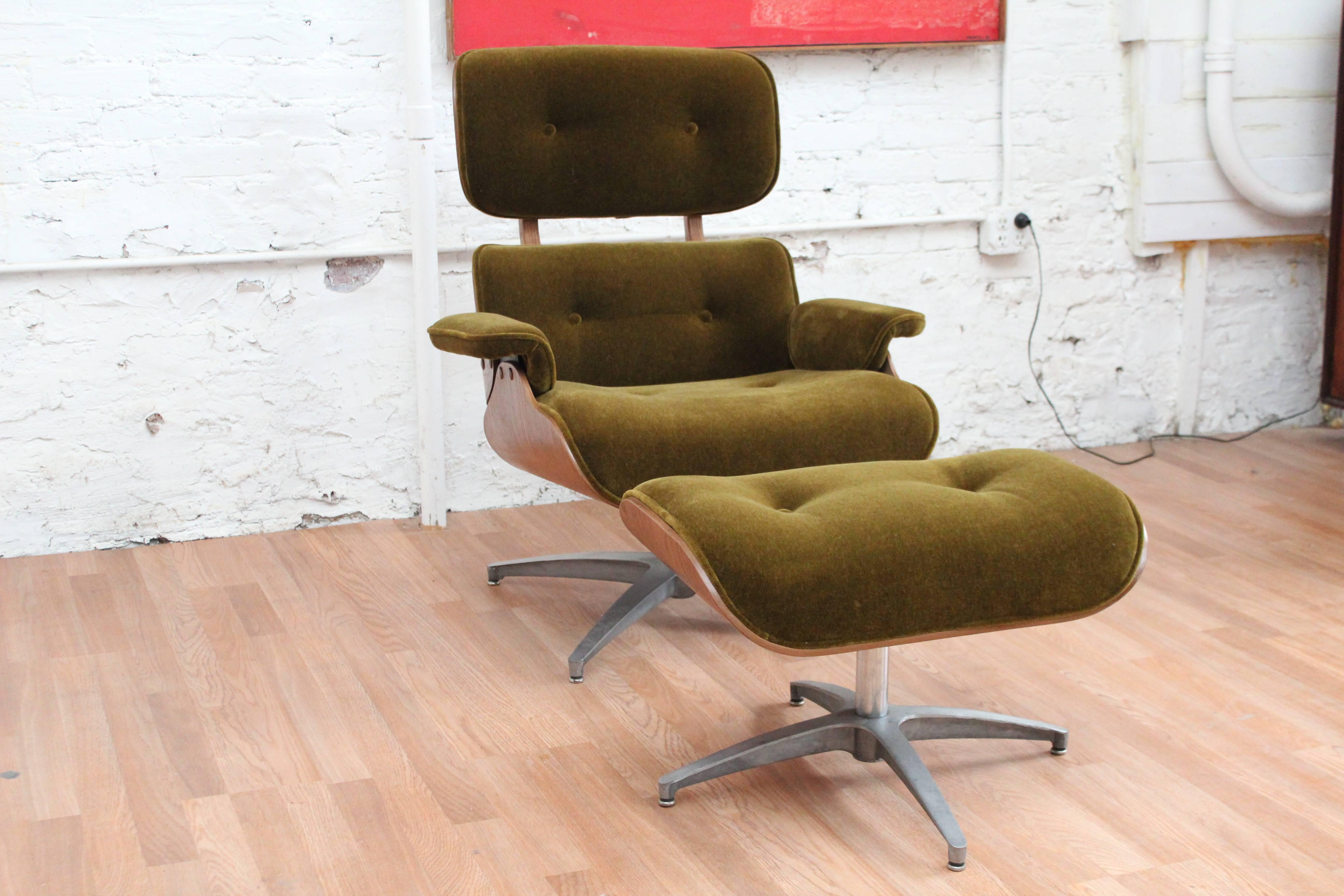 Eames style lounge chair and ottoman by the Charlton Company. This vintage chair features a bent walnut plywood back and is newly and fully upholstered in a sumptuous green mohair, just to give it an extra joosh! What do think about the button tuft?