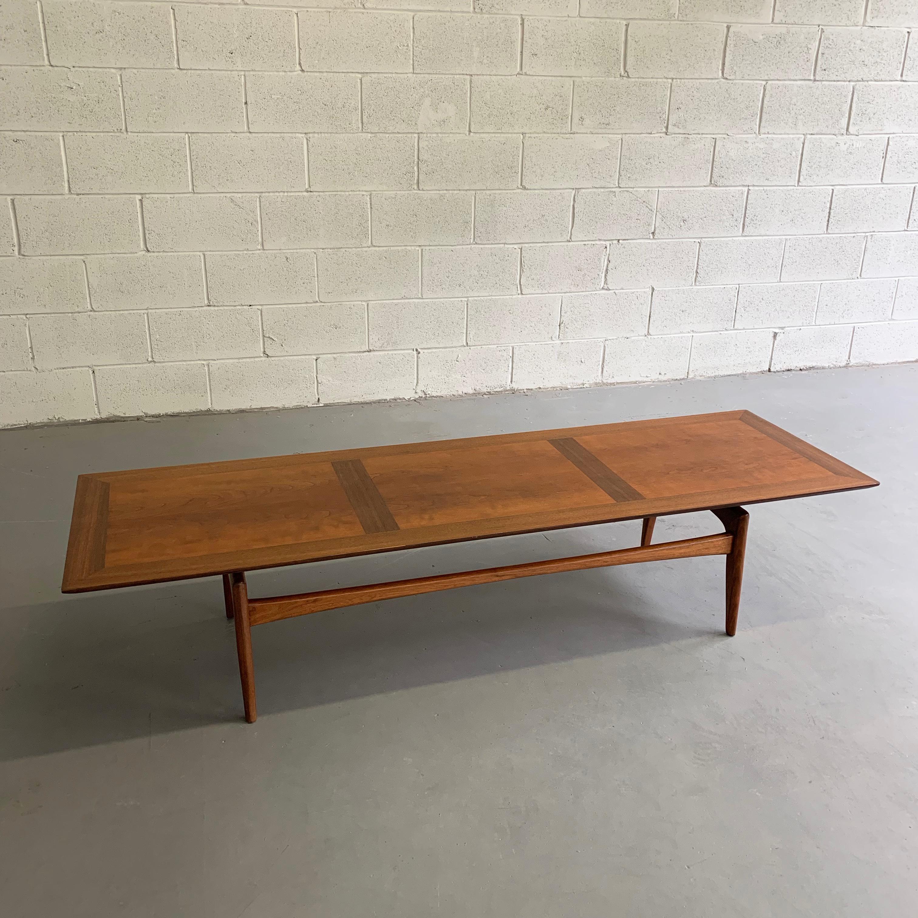 Mid-Century Modern, coffee table manufactured by John Stuart features a cherry and walnut parquetry top with floating walnut base.