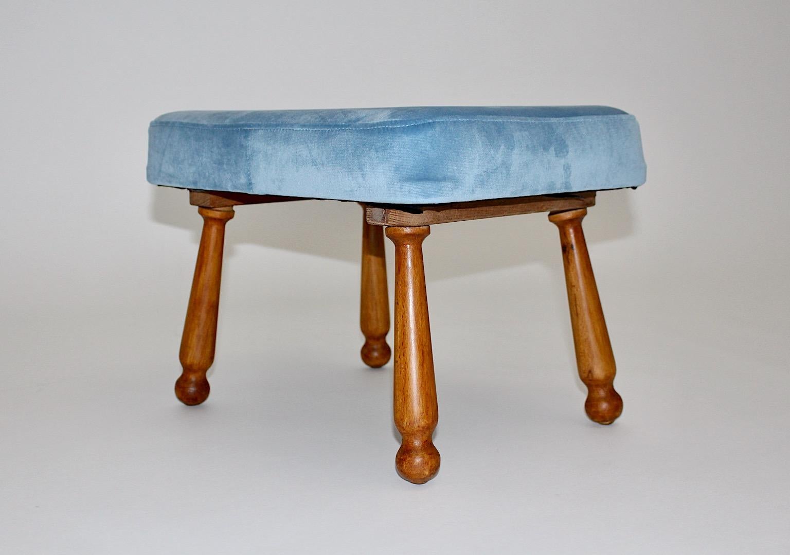 Mid Century Modern vintage rectangular like footstool from cherrywood with pastel blue velvet upholstery, Josef Frank style, 1950s Austria.
A stunning footstool new covered with pastel blue velvet fabric from honey brown cherrywood. While the