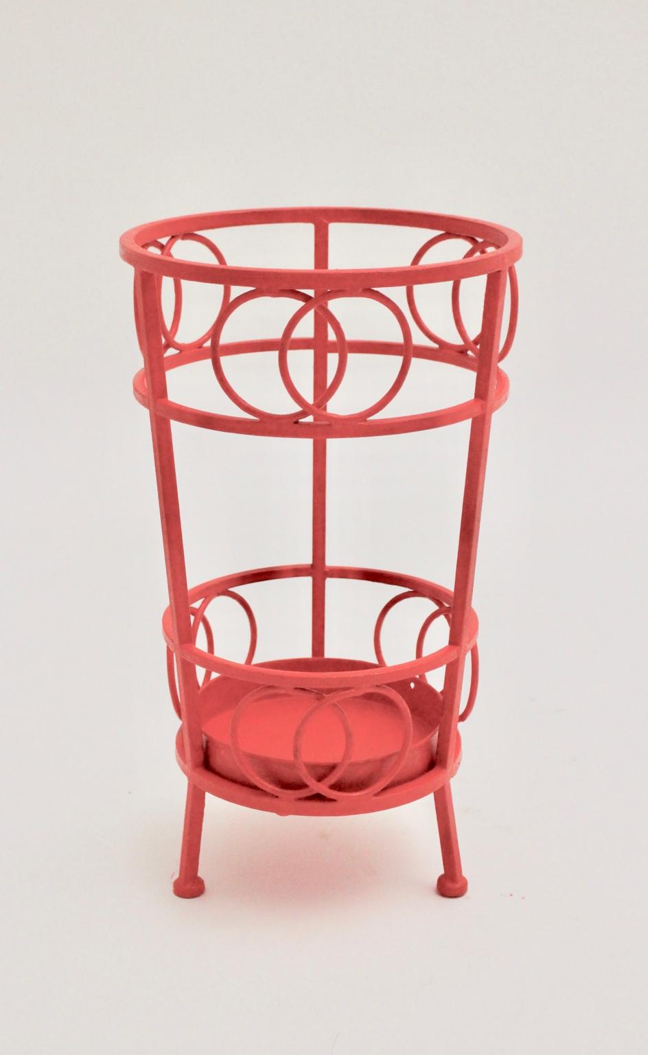 This umbrella stand was designed and made in Austria, circa 1970.
Also the umbrella stand was made of metal and is new lacquered in the color cherry red. Additionally the piece is decorated with round shaped elements and shows a removable drip