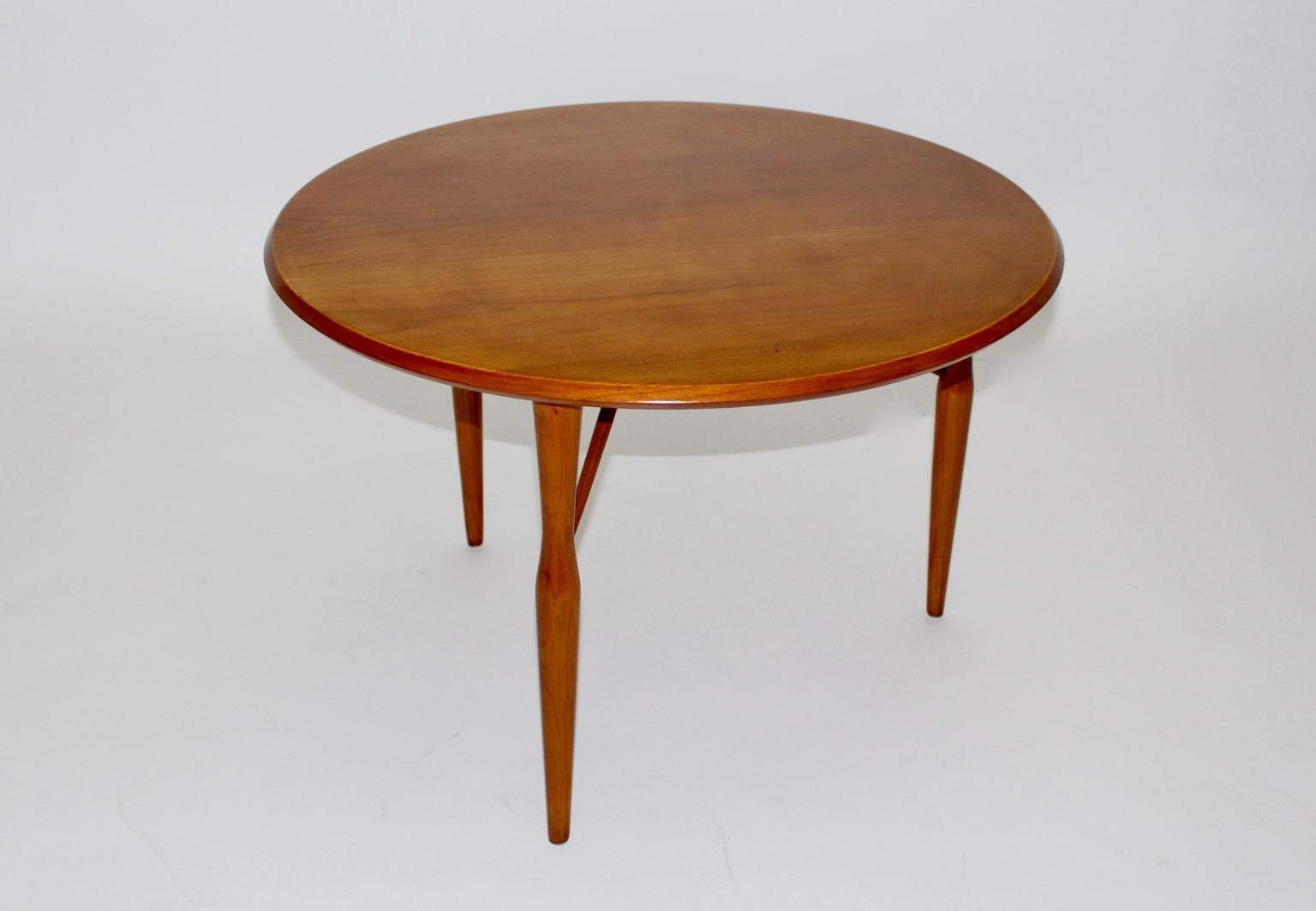 We present an elegant coffee table from honey colored cherrywood by Josef Frank for Svenskt Tenn attributed, Sweden 1950s.
The coffee table features three round bars tasking to fix the table and also as decor.
Furthermore the coffee table is