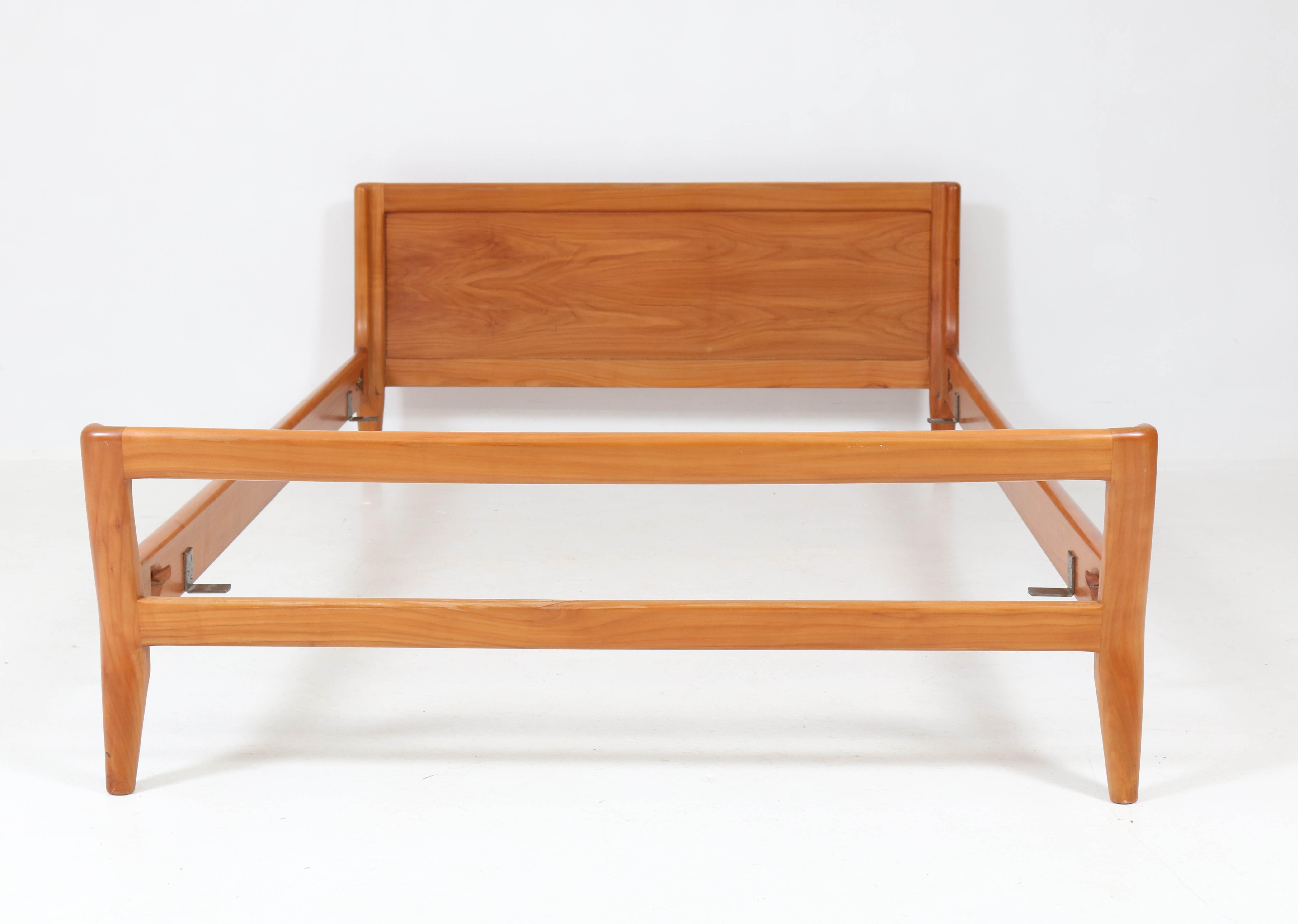 Stunning and rare Mid-Century Modern organic bed.
Solid cherrywood.
Striking Danish design from the sixties.
In good original condition with minor wear consistent with age and use,
preserving a beautiful patina.
Measurements inside: 117.5 cm or