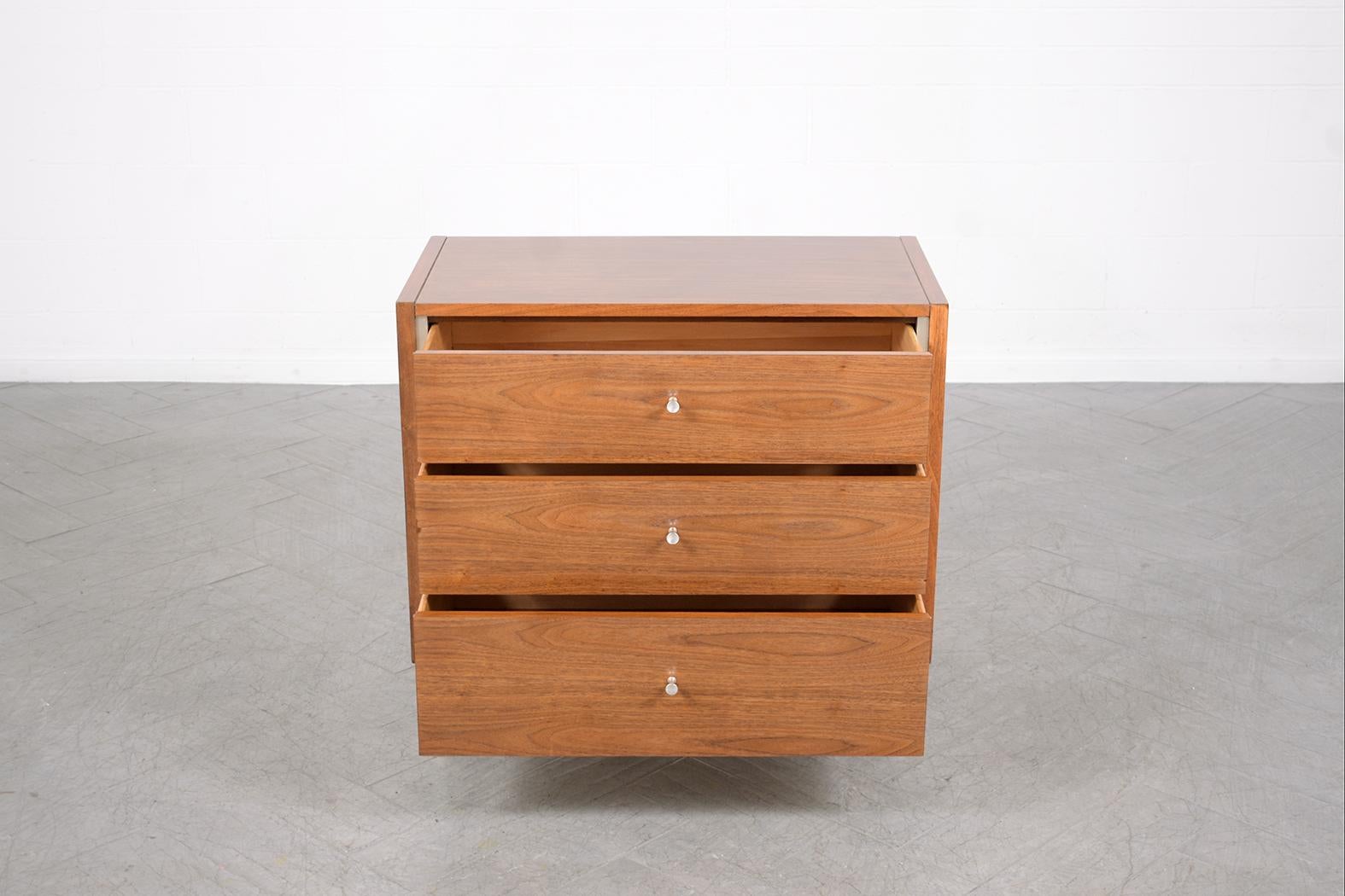 American Restored Mid-Century Walnut Chest of Drawers with Brushed Steel Moldings For Sale