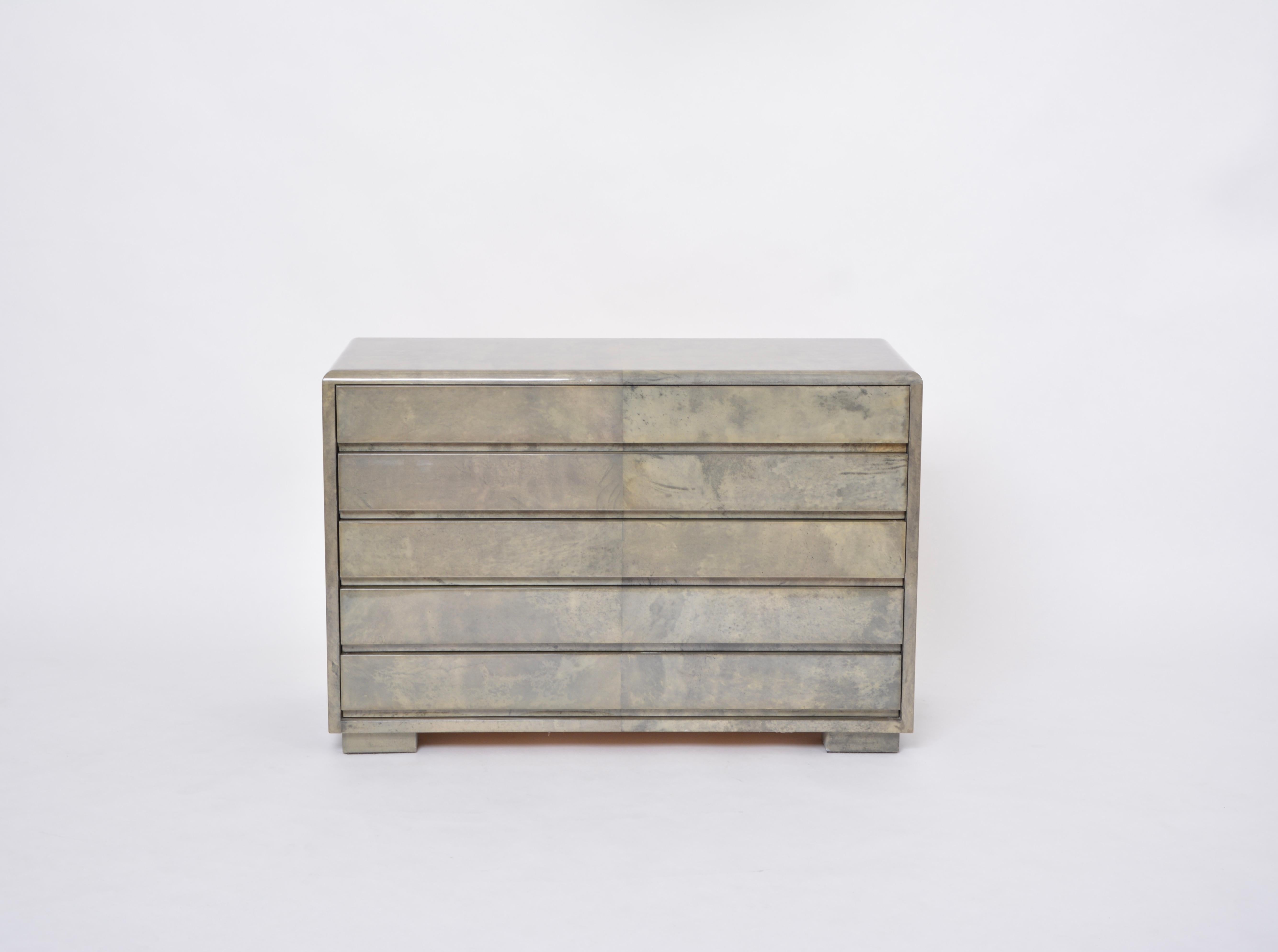 Mid-Century Modern Chest of drawers made of wood and laquered Goat Skin by Aldo Tura designed by Aldo Tura and produced in Italy approximately in the 1970s.
This chest of drawers has a wooden structure which is covered in Aldo Tura's signature style