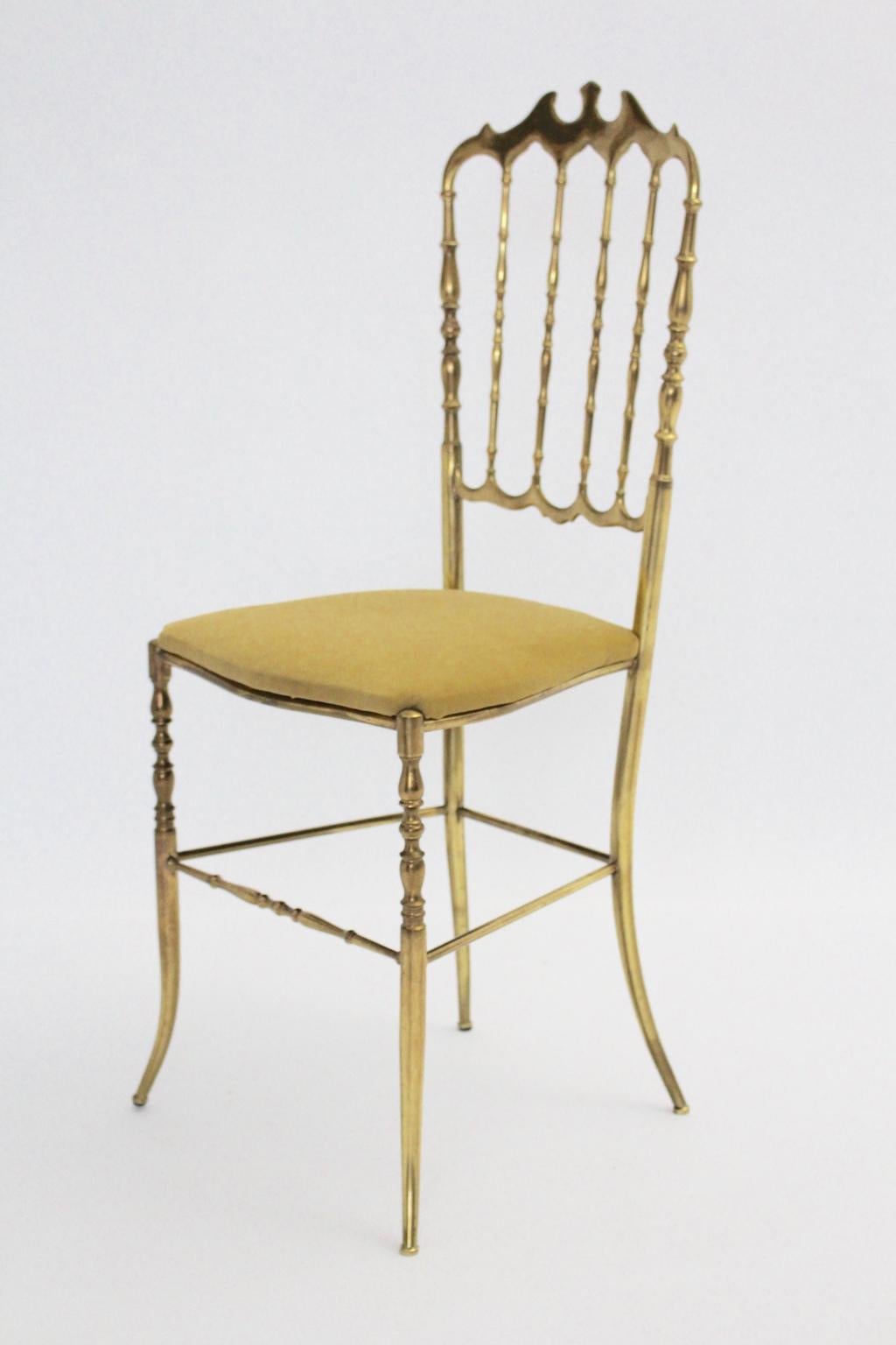 Mid Century Modern Vintage Chiavari side chair from brass with renewed yellow velvet fabric seat.
This wonderful side chair or chair Chiavari shows a beautiful brass patina as a desirable signs of age, while the upholstered seat is covered with new