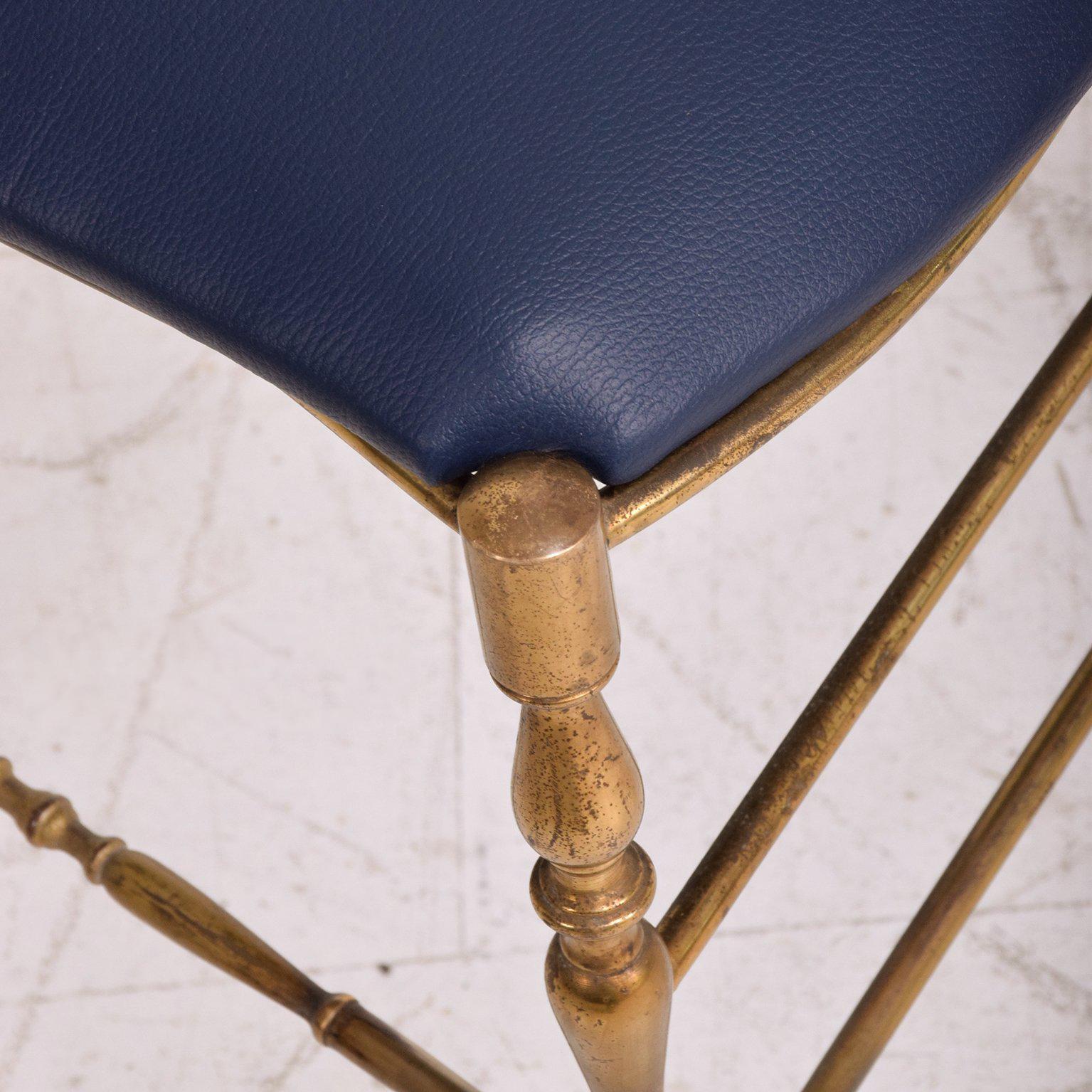 We are pleased to offer for your consideration a vintage Italian Chiavari chair in brass.
Seat in faux leather in blue color. 
39 1/2" tall x 16" D x 15" W 
Seat 19" tall

Italy, circa 1950s.

