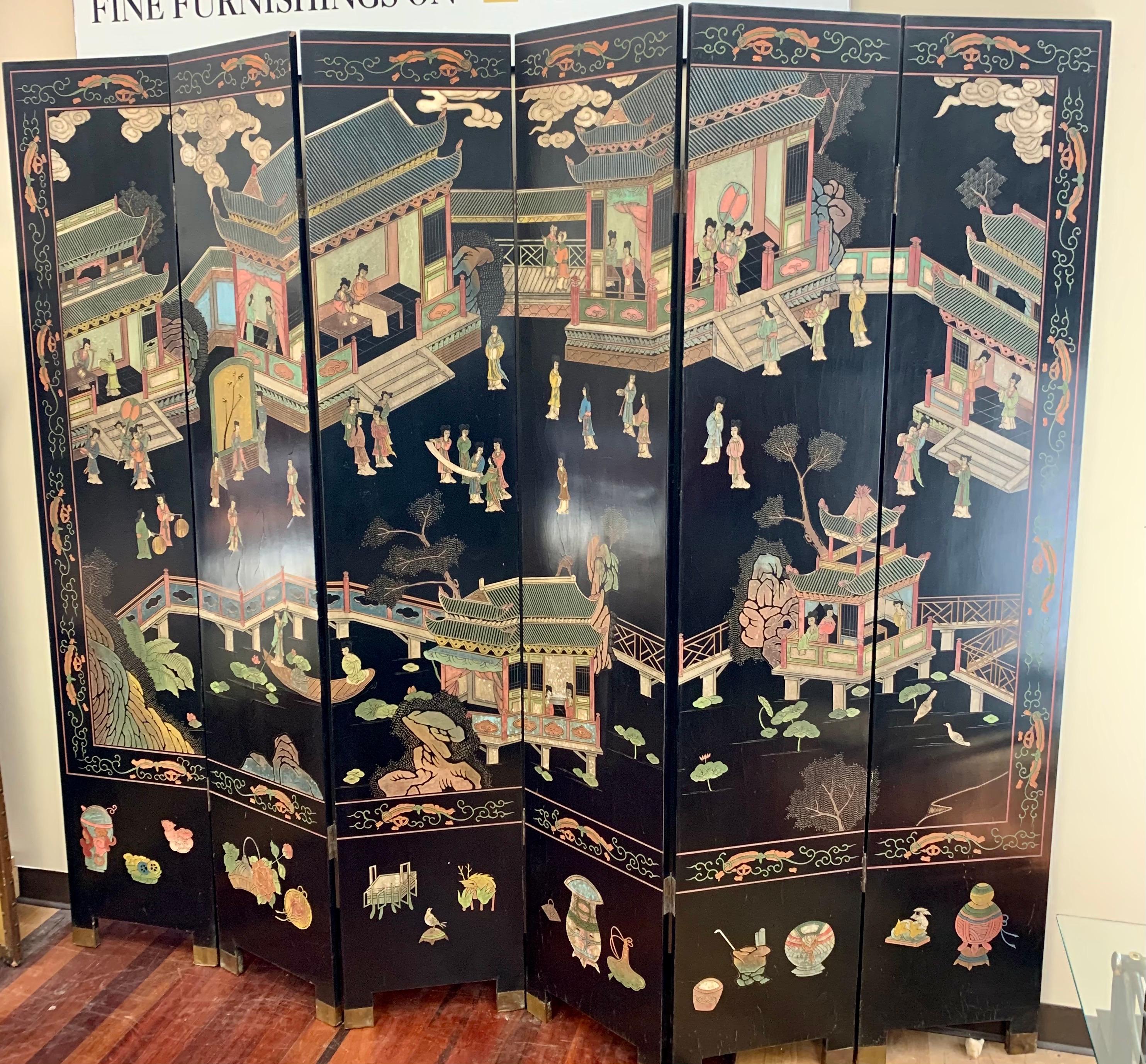 Magnificent eight panel lacquered Coromandel screen that measures seven feet tall. Front and back are two different works of art with the front being much more detailed, see pics.