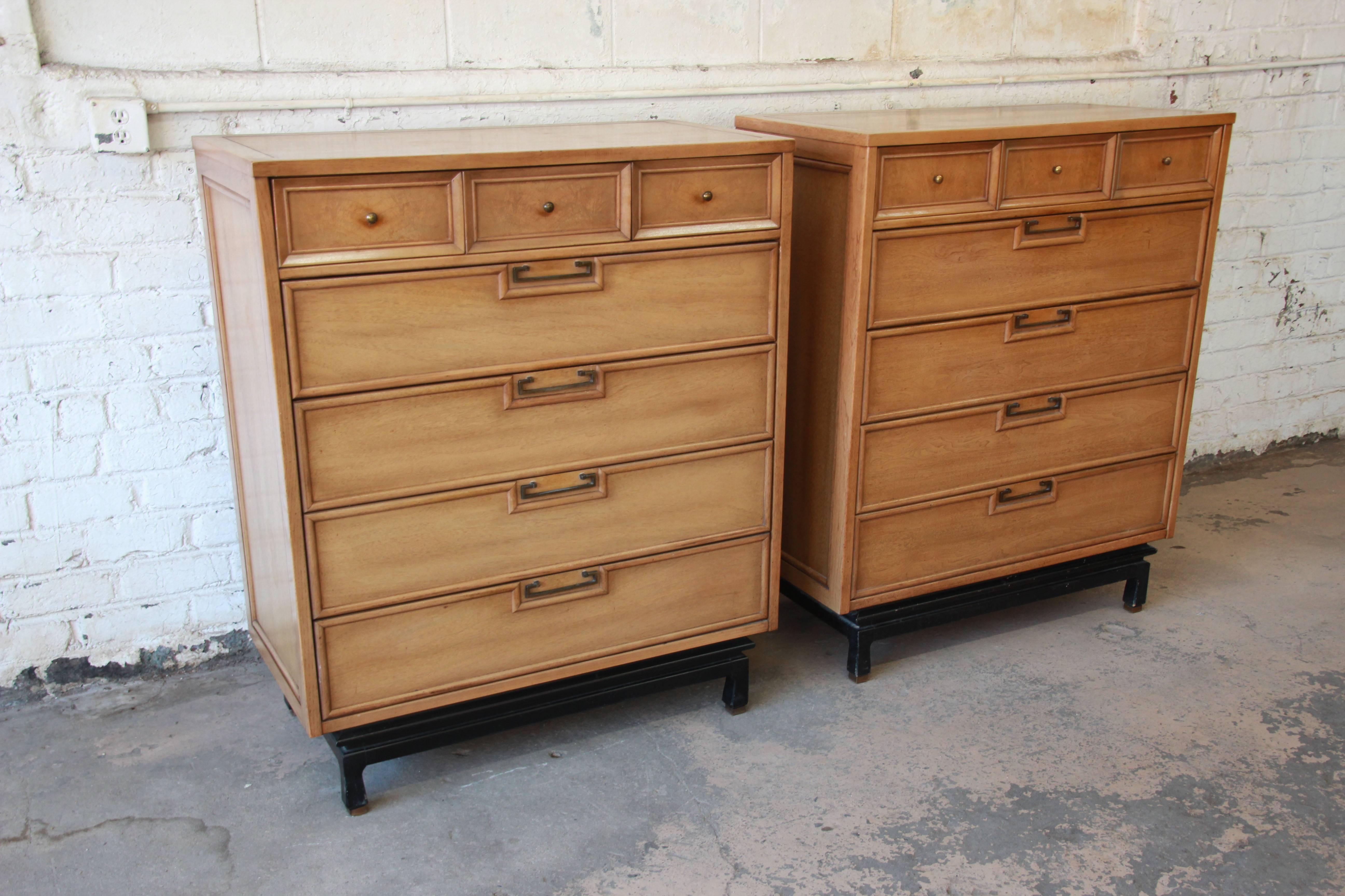 Your choice of two gorgeous Mid-Century Modern Hollywood Regency chinoiserie highboy dressers designed by Merton Gershun for American of Martinsville. The dressers feature beautiful bleached walnut wood grain and original brass drawer pulls. They