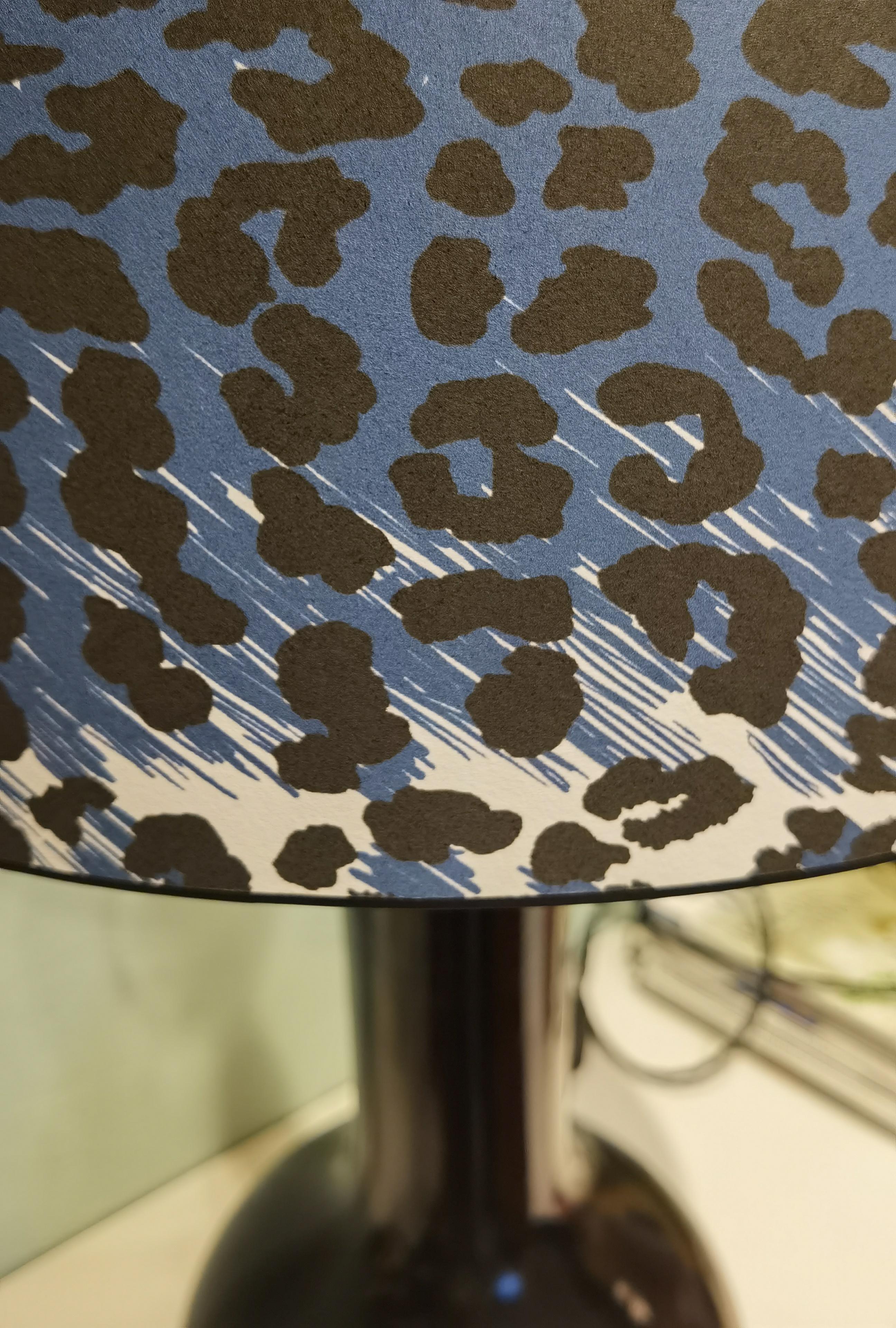 Mid-Century Modern large table lamp transformed from a chinese porcelain vase black glazed by Sofina Boutique Kitzbühel. Wired with a black cotton fabric cable and for 2 bulbs.
The height is adjustable. Shade handmade from wallpaper in blue and