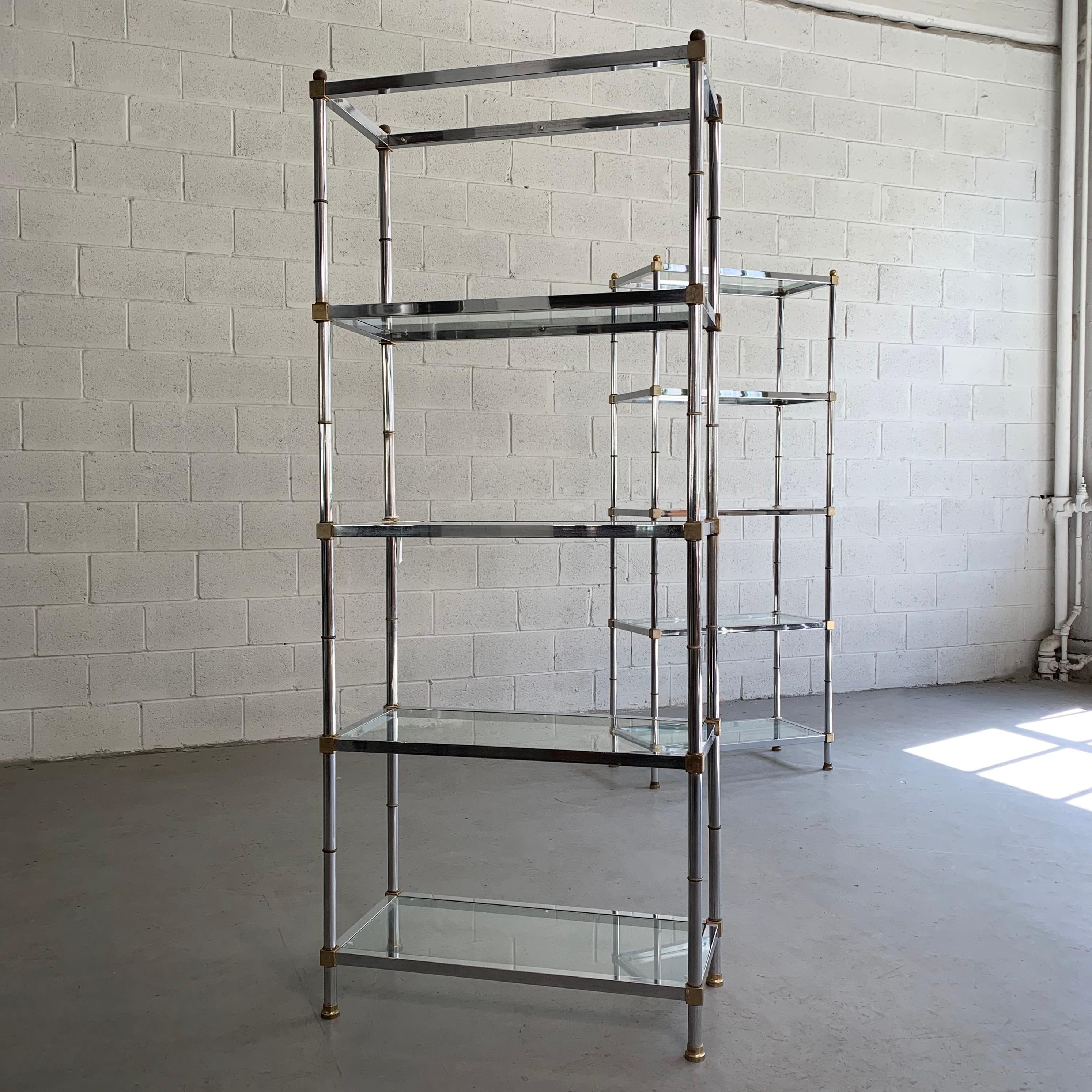 Pair of Mid-Century Modern, open shelving, étagères feature chrome frames with brass accents and glass shelves that are spaced 16 inches apart.