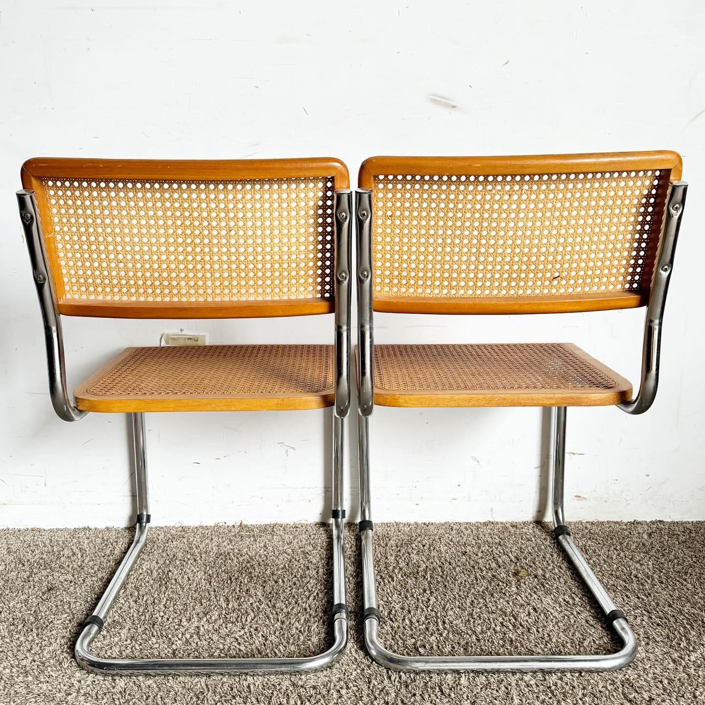 Embrace mid-century modern sophistication with these Chrome and Cane Marvel Breyer Style Cantilever Chairs. Featuring a sleek cantilever design, these chairs combine polished chrome frames with woven cane, offering a striking material contrast.