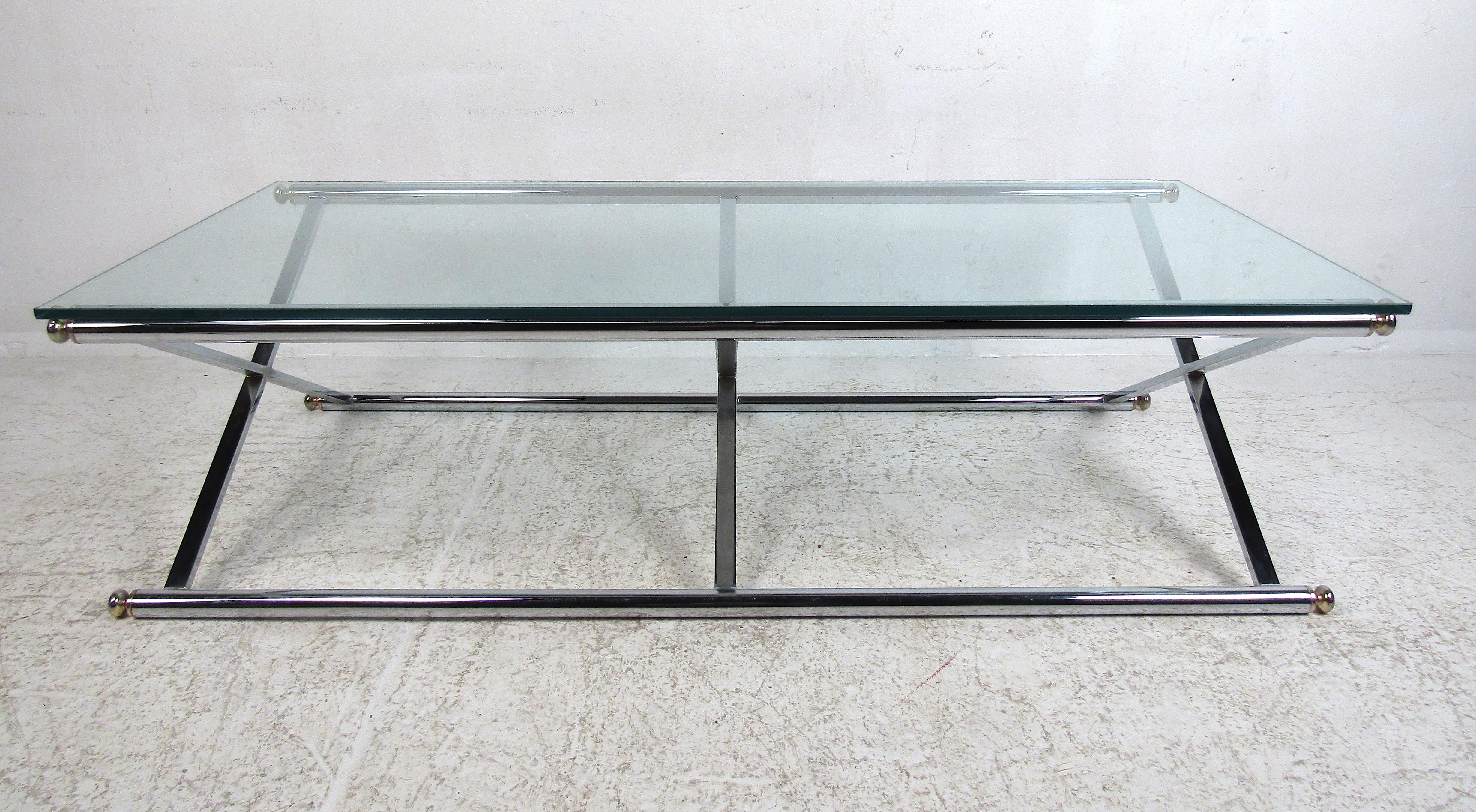 This beautiful vintage modern coffee table features a chrome base with a unique 