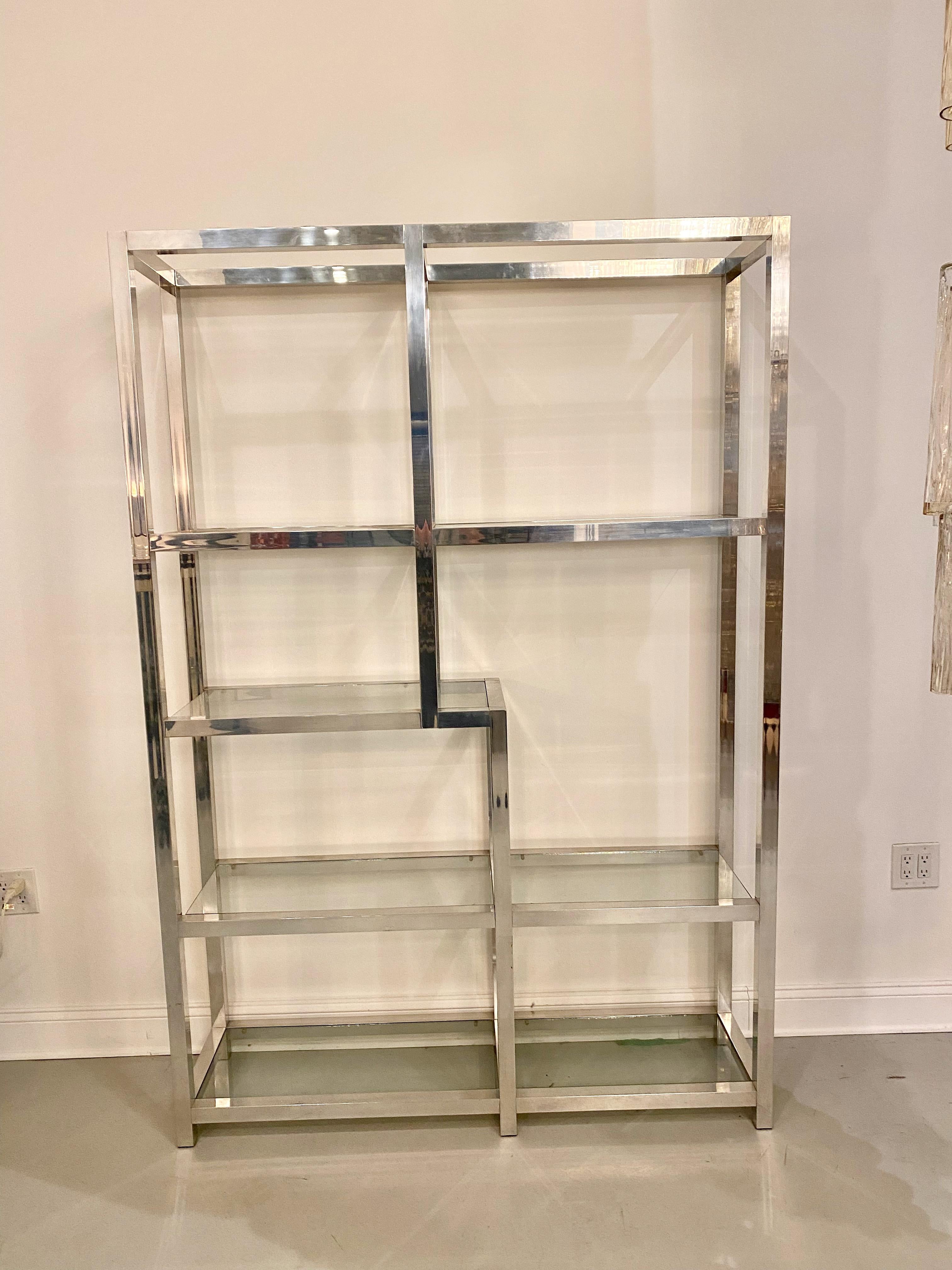 Mid Century Modern display case. Chrome frame holding seven glass shelfs.