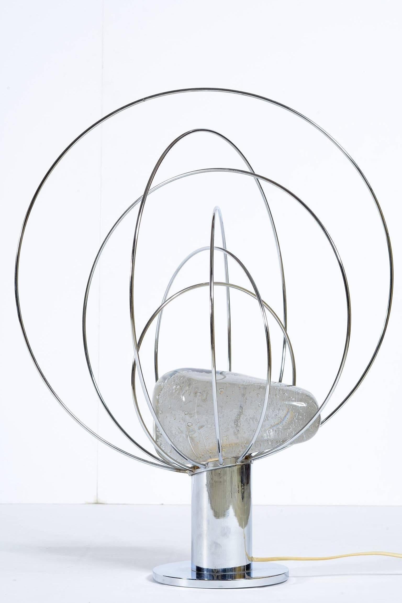 Metal chromed structure with a bulb inside to light a Murano glass with buble air inside .
This lamp was designe by Angelo Brotto for Esperia -Poggibonsi -Siena in the space age mid century .
Italy 1960's.