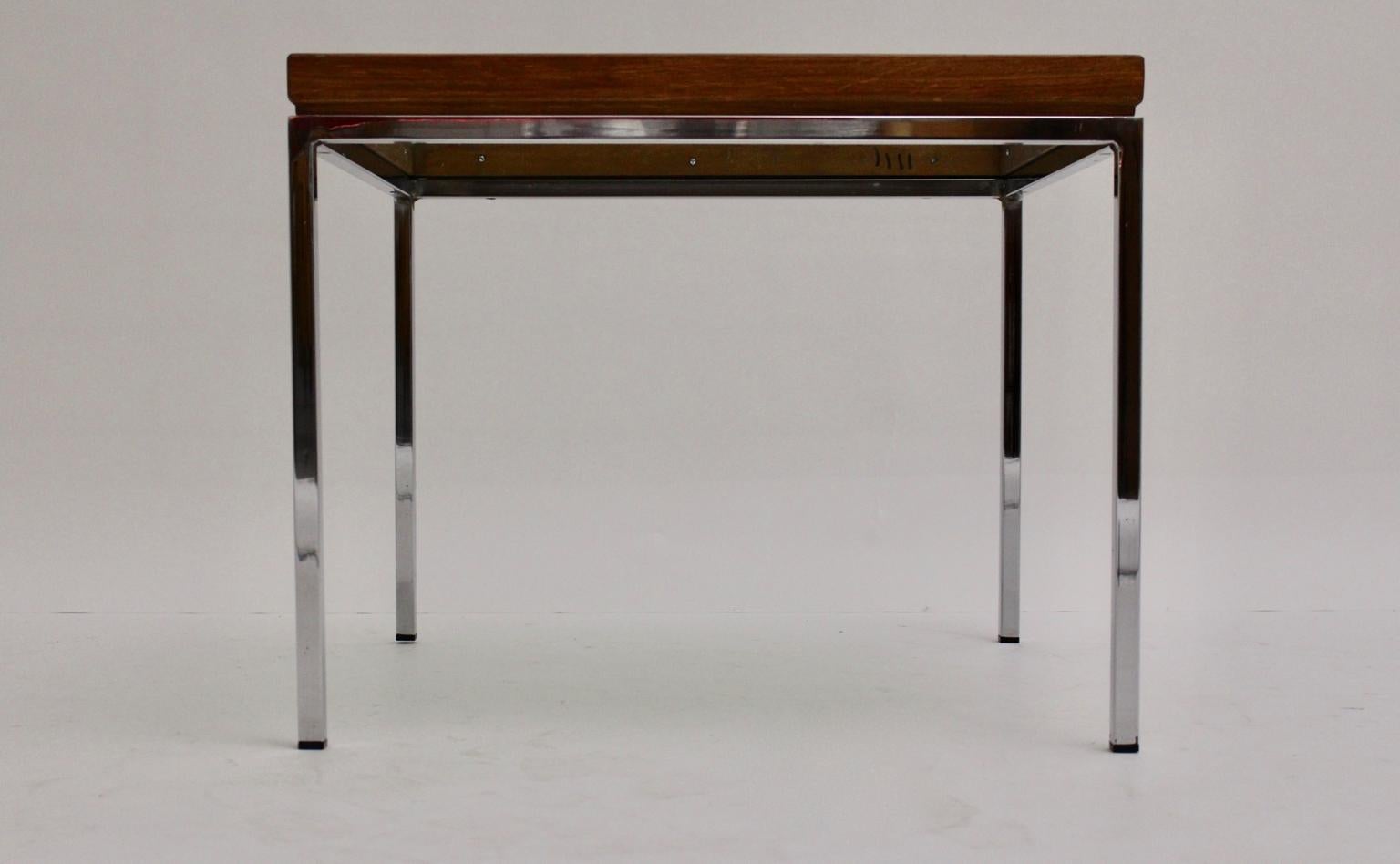 Modernist vintage coffee table shows a pure design from the 1970s. The coffee table by Wiesner- Hager, Austria features a chromed base with a solid oak frame and a smoked glass top.
Very good condition with minor signs of age.

approx. measures: