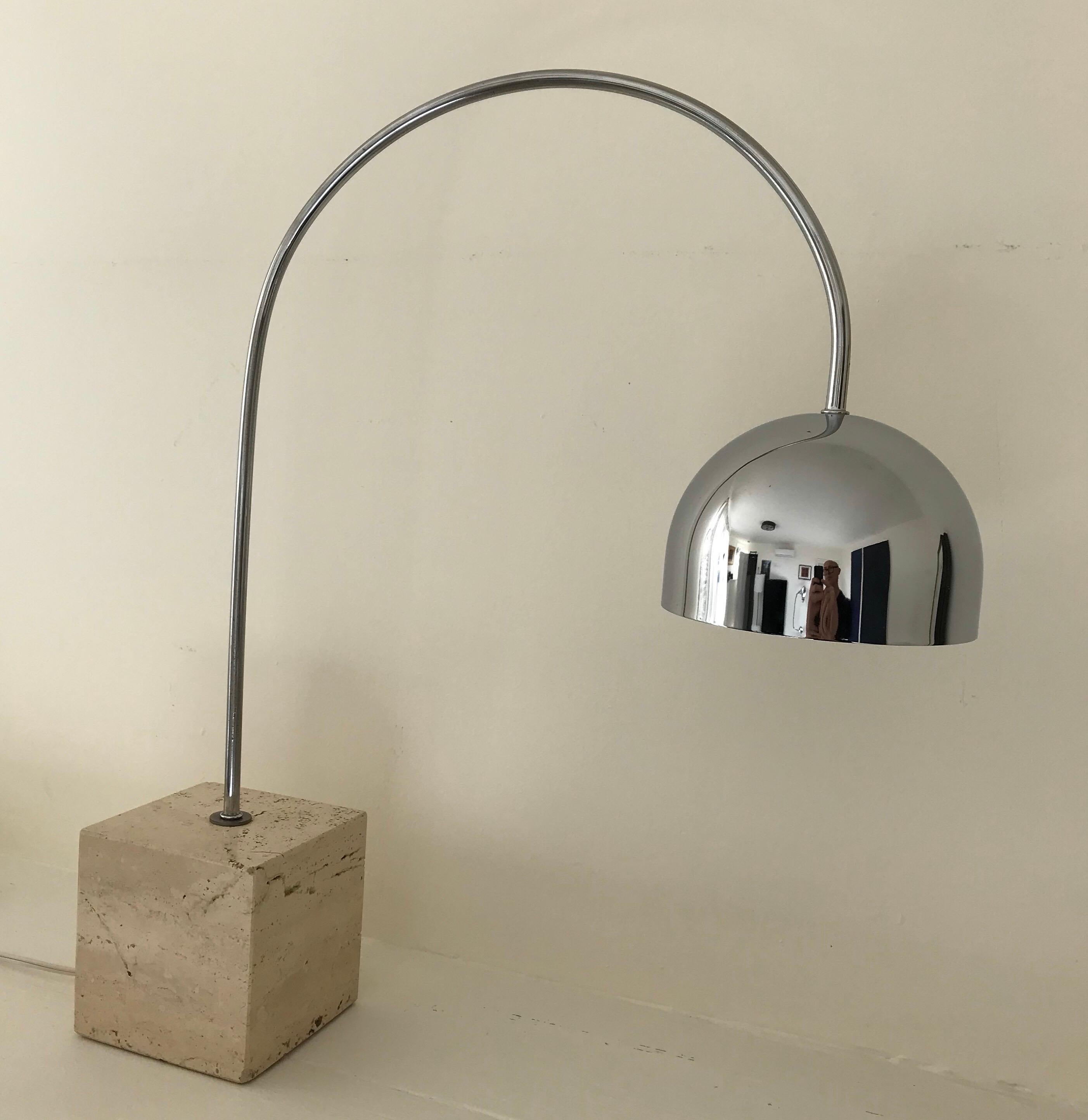 Very cool arc table or desk lamp in chrome with a square travertine base by Harvey Guzzini, Italy. In-line three way switch, bulb not included.