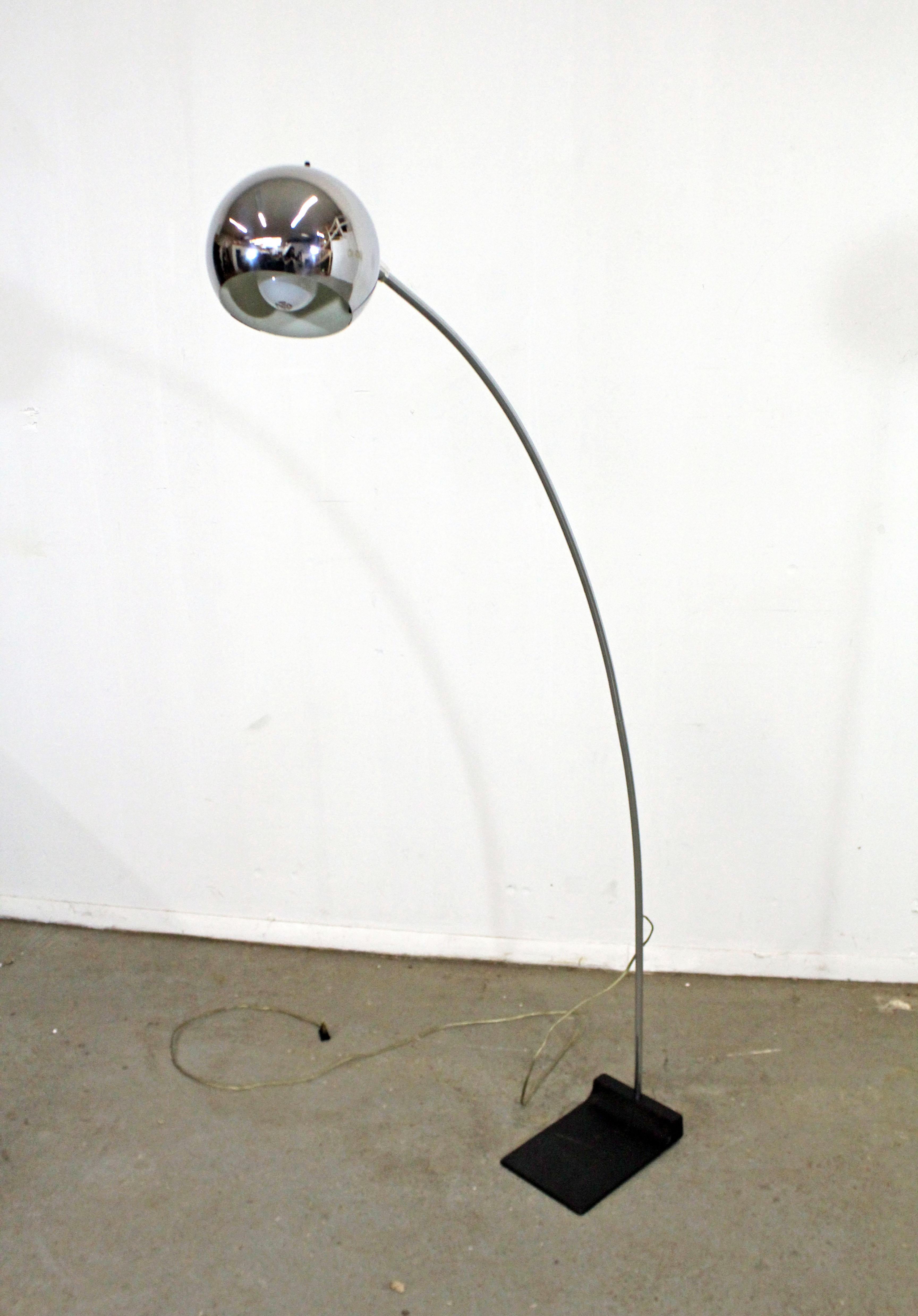 Offered is a beautiful Mid-Century Modern vintage arc floor lamp. The lamp is made of chrome and has a steel base. Features an adjustable head and arced stand that comes apart. It is in good vintage condition, has been tested and works. Shows some