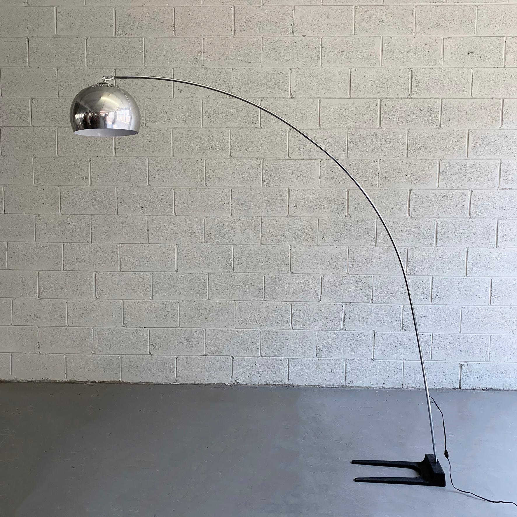 Mid-Century Modern, arc floor lamp features a 63 inch deep, chrome arc stem with dome shade and forked, cast iron, counter balance base. The lamp is wired to accept up to a 200 watt bulb.