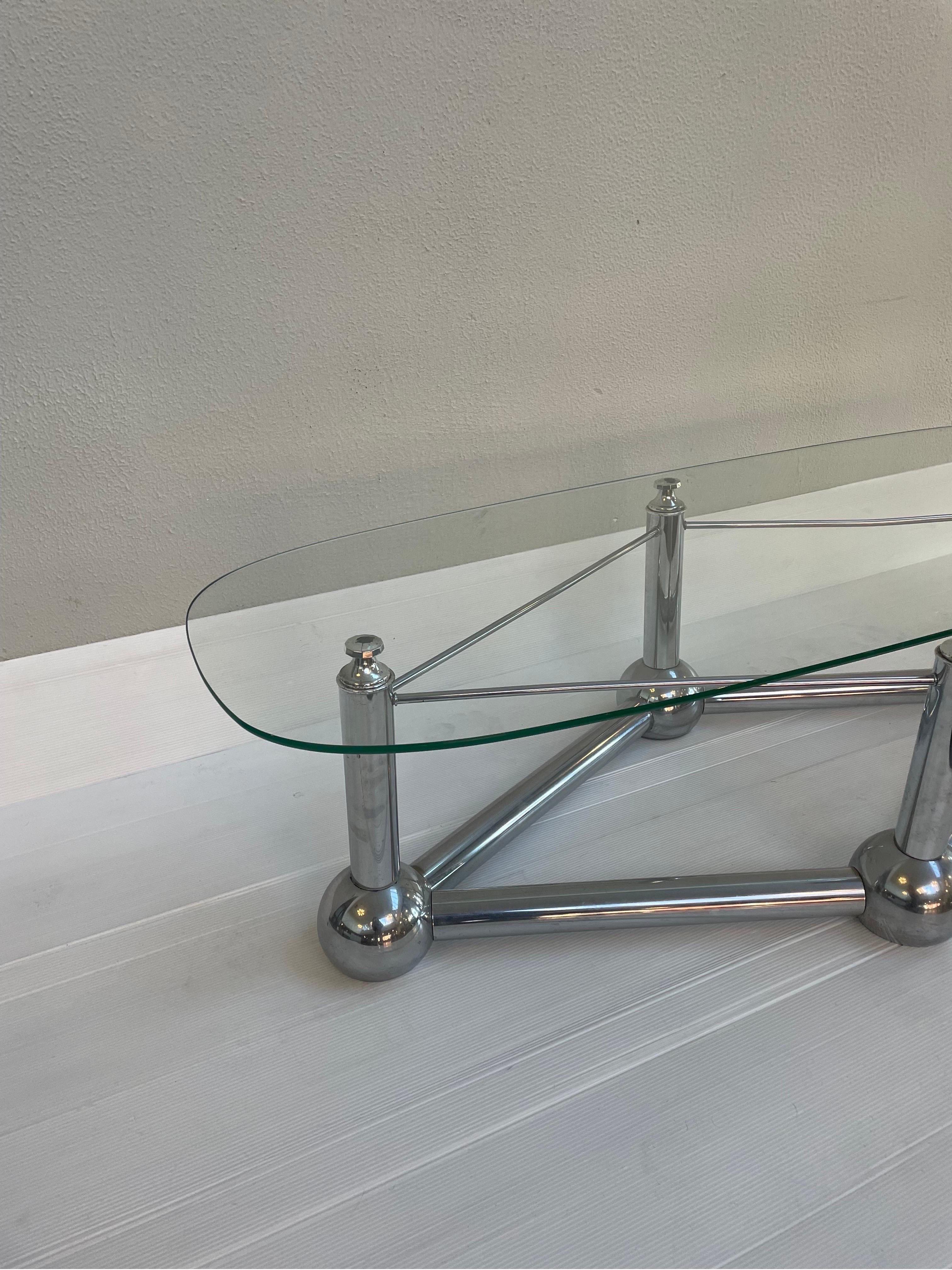 Vintage Mid-Century Modern rhombus shaped base featuring tubular chrome frames with orb bases and a glass top.