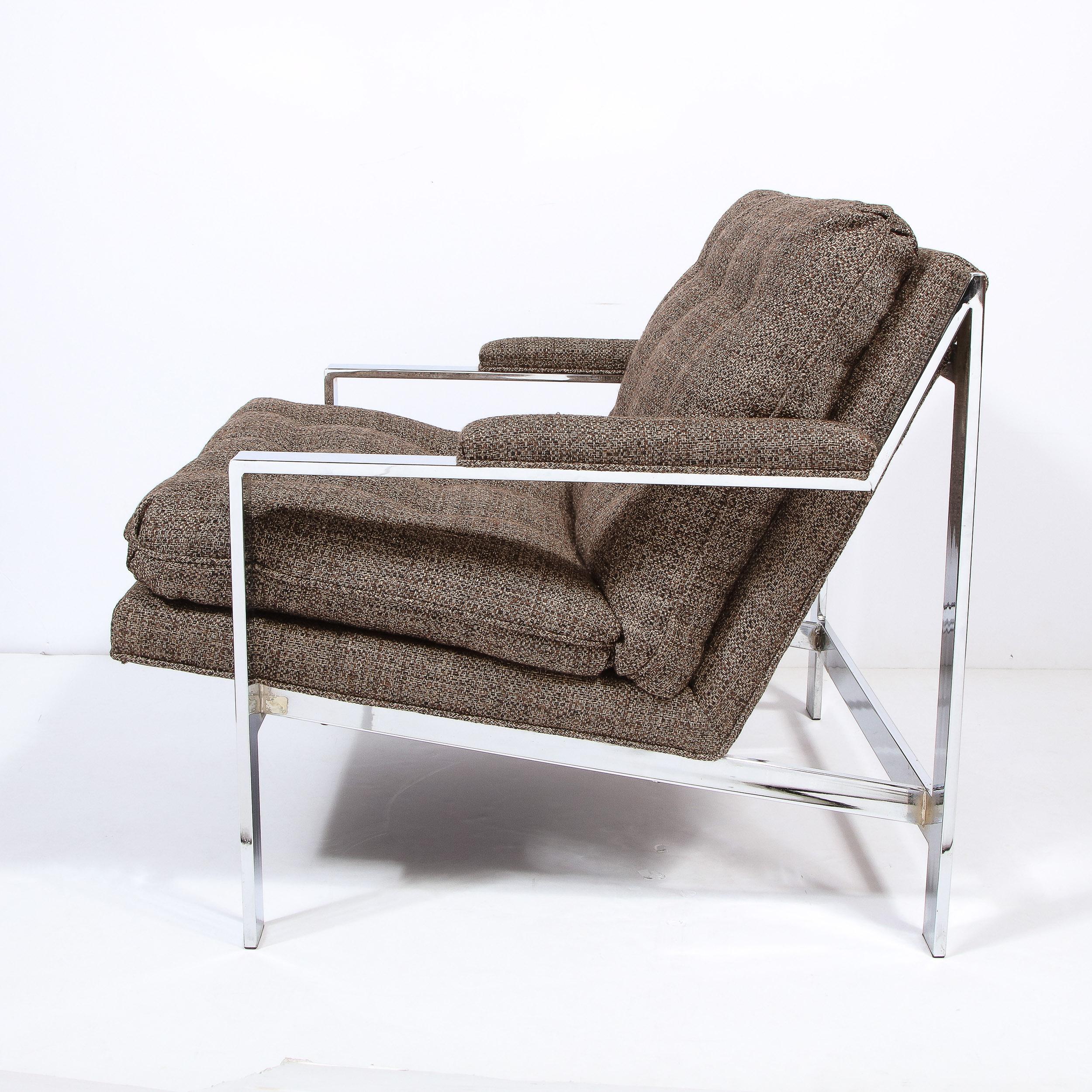 This graphic and refined Mid-Century Modern lounge chair was realized in the United States circa 1970. It features a sculptural silhouette with rectangular arms; aprons; side slats; and back supports all in lustrous chrome. Additionally, the chair