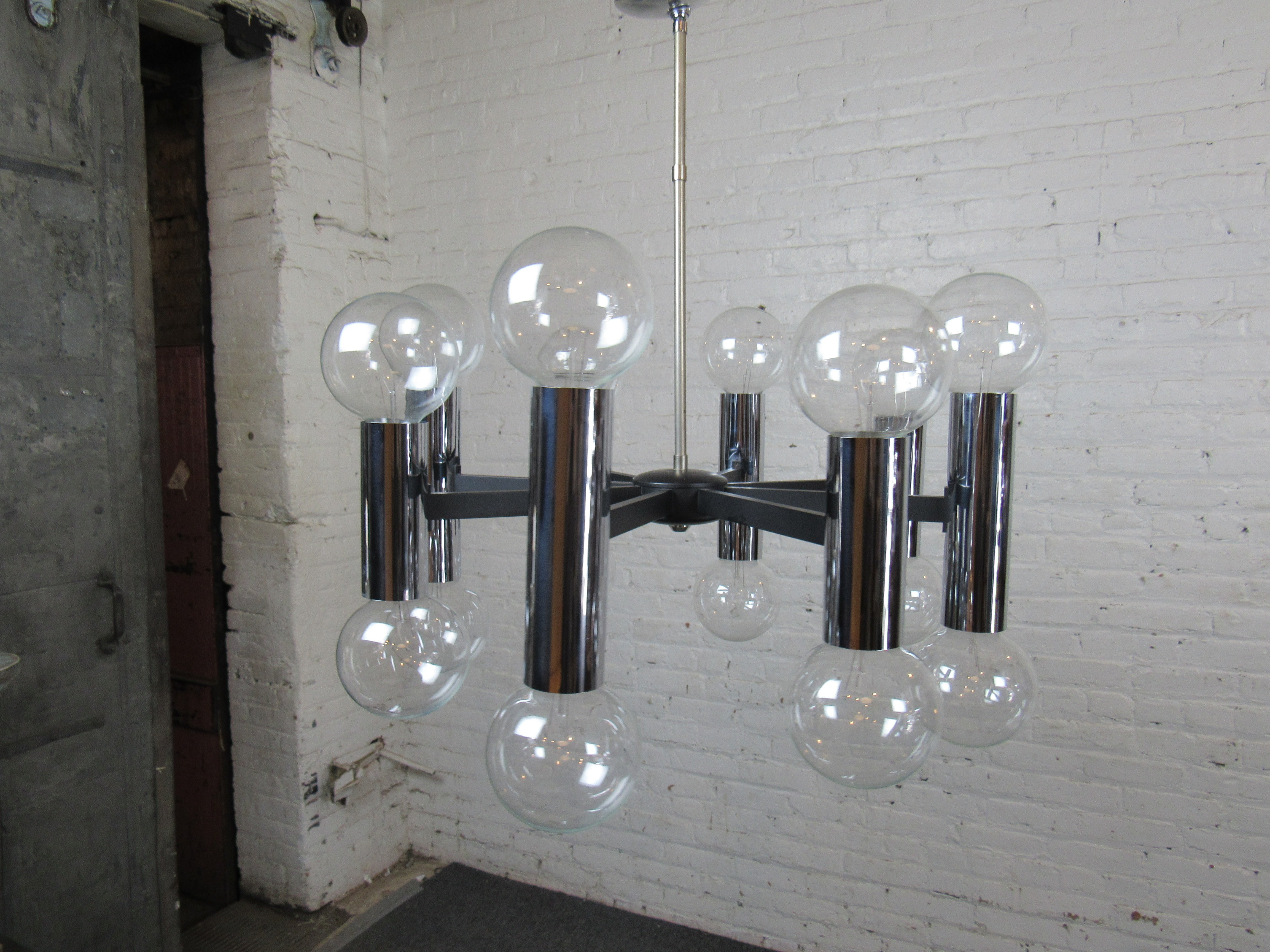 Great chrome chandelier with bulbs on both ends. Polished chrome frame with 16 total sockets.
Location: Brooklyn NY.