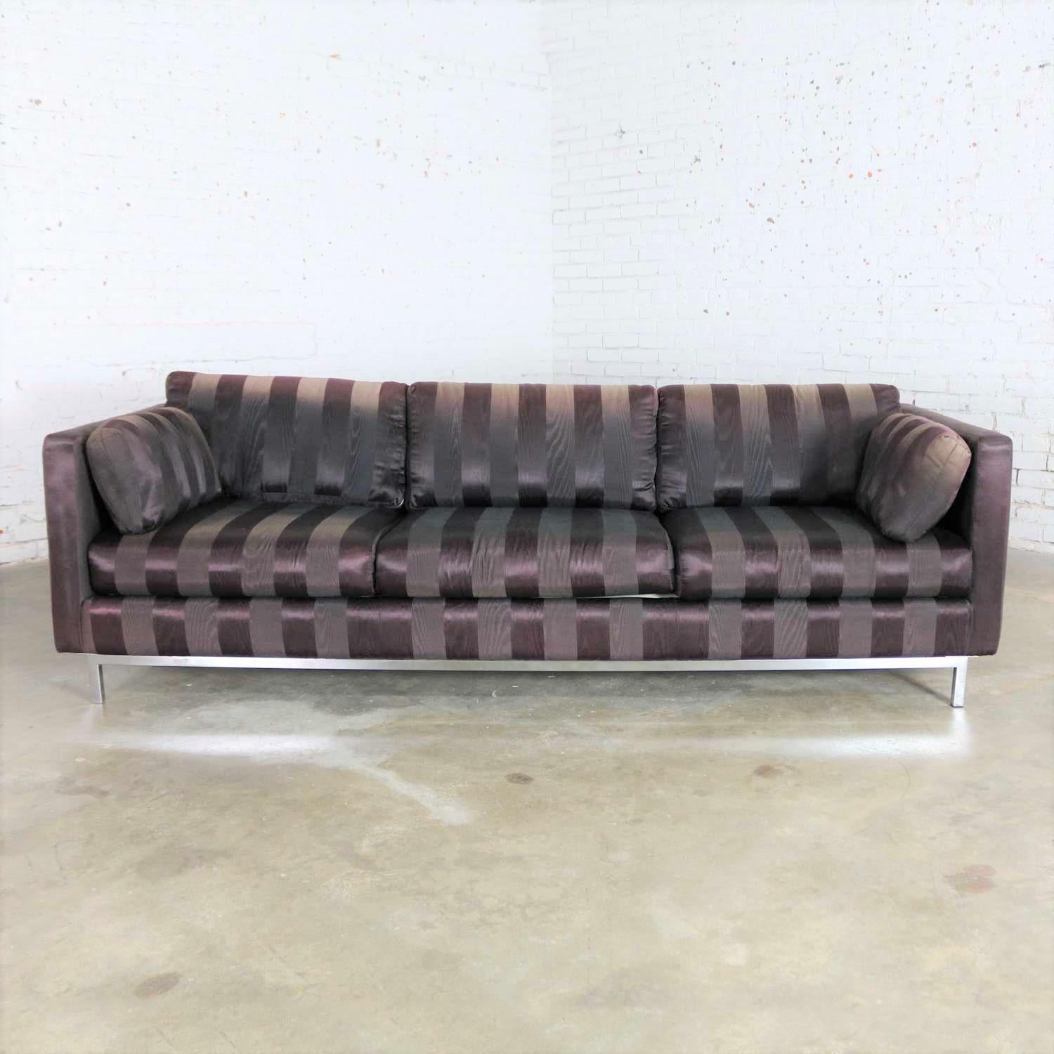 Handsome Mid-Century Modern tuxedo cube sofa with chrome legs in the style of Florence Knoll or Milo Baughman. The chrome legs and the frame are in fabulous vintage condition. Then there is the fabric. I’m told it was originally black satin. It has