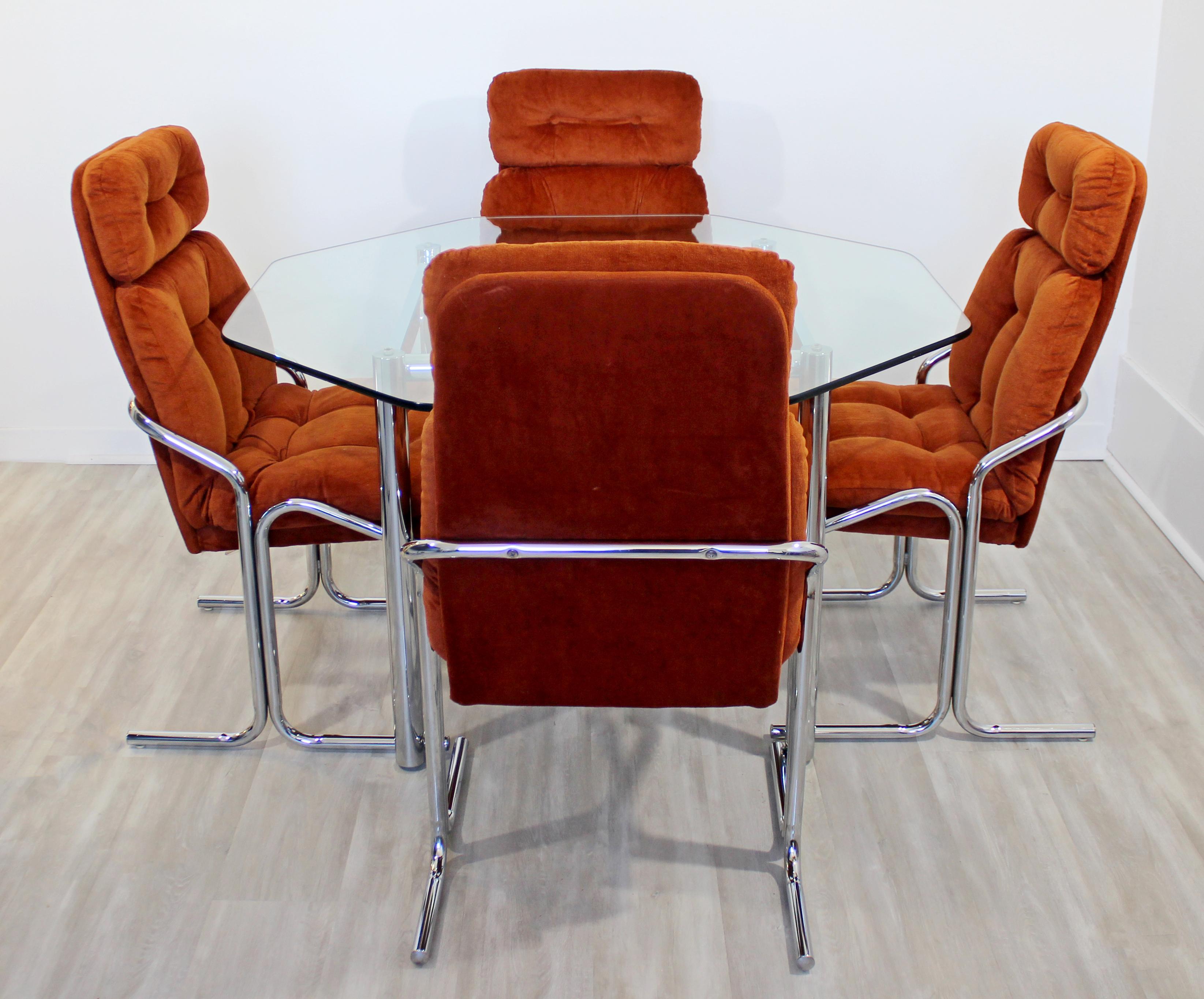 For your consideration is a magnificent dinette set, including four upholstered side chairs, and an octagon shaped glass top, by Cal-Style Furniture Manufacturing, circa 1979. In very good vintage condition, 1970s. The dimensions of the table are