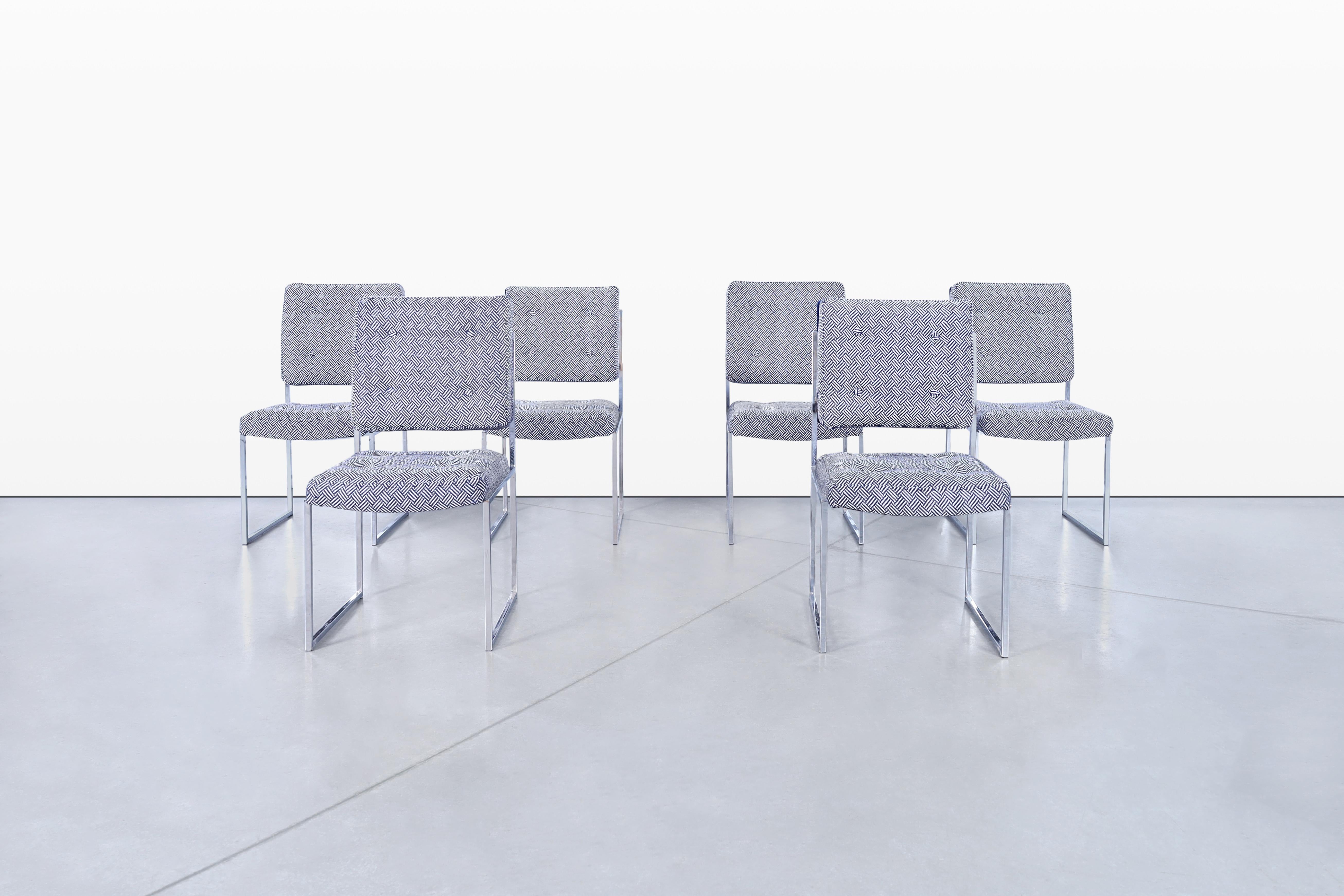 A stunning set of six mid-century modern dining chairs that seamlessly blend clean architectural lines with bold textile contrast. The design is strongly reminiscent of the work of Milo Baughman, known for his iconic collaborations with Thayer