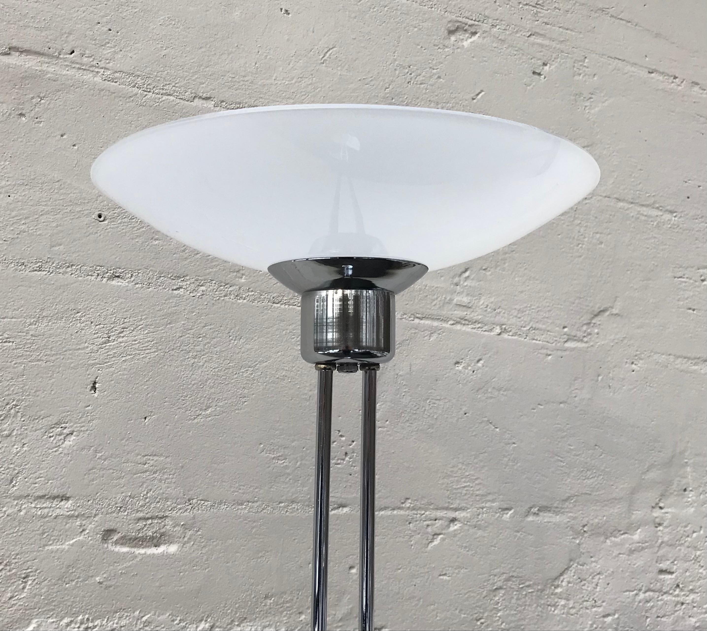 Very tall and lean chrome floor lamp with milk glass saucer shaped diffuser, 1970's.
