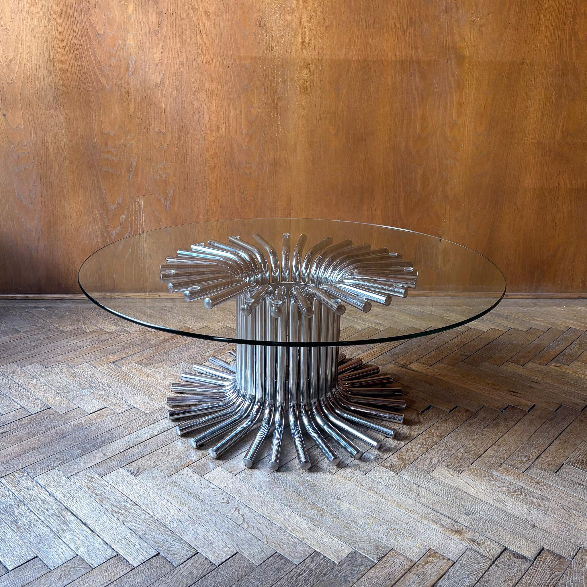 
Mid-Century Modern Chrome Glass Coffee Table, Italy 1970s.

This striking coffee table, produced in Italy during the 1970s, exemplifies the bold Space Age design aesthetic of the era. The base is composed of individual chrome tubes, arranged in a