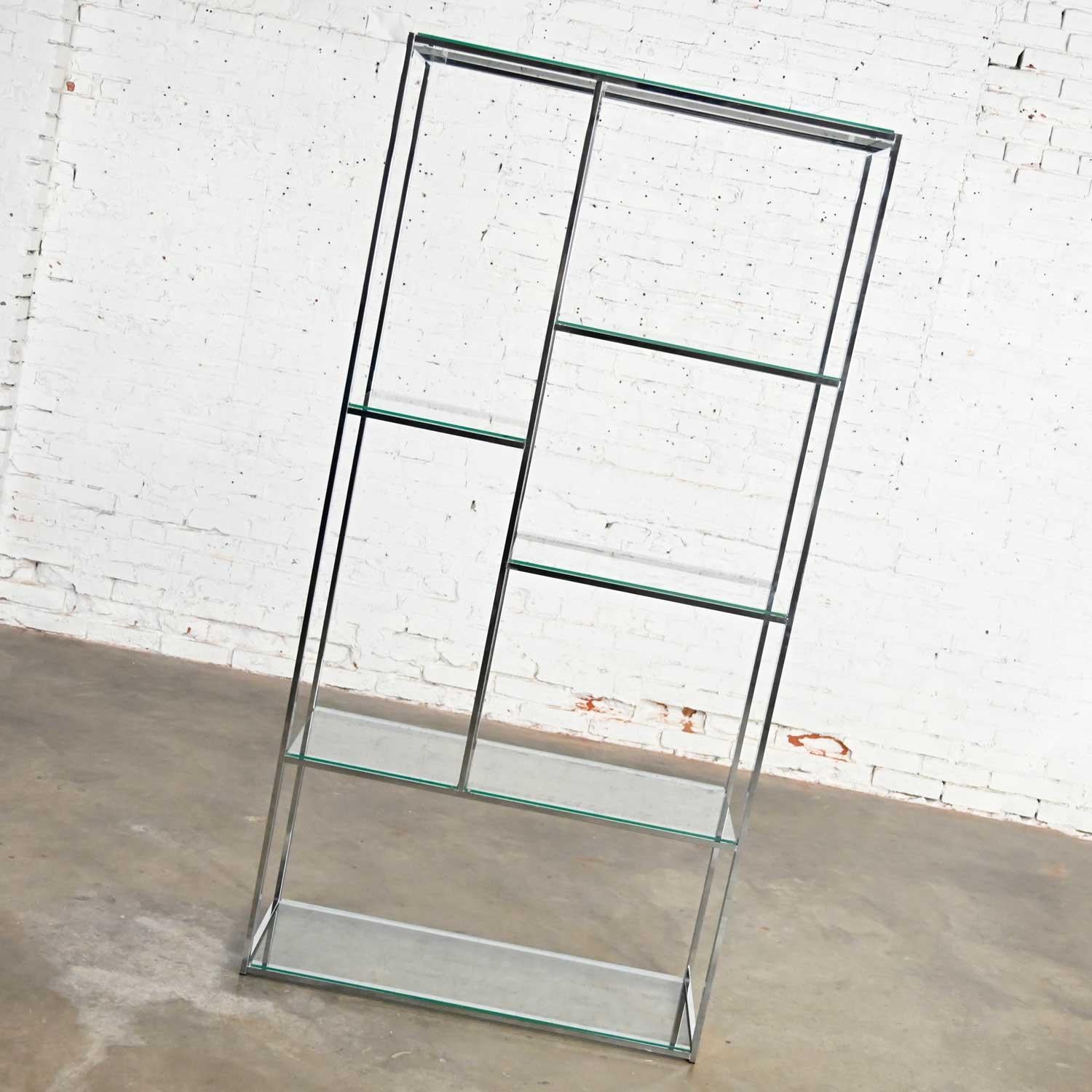 Lovely Mid-Century Modern chrome etagere with 6 glass shelves with Piet Mondrian shelf placement. Beautiful condition, keeping in mind that this is vintage and not new so will have signs of use and wear. No chips or chiggers that we have detected.