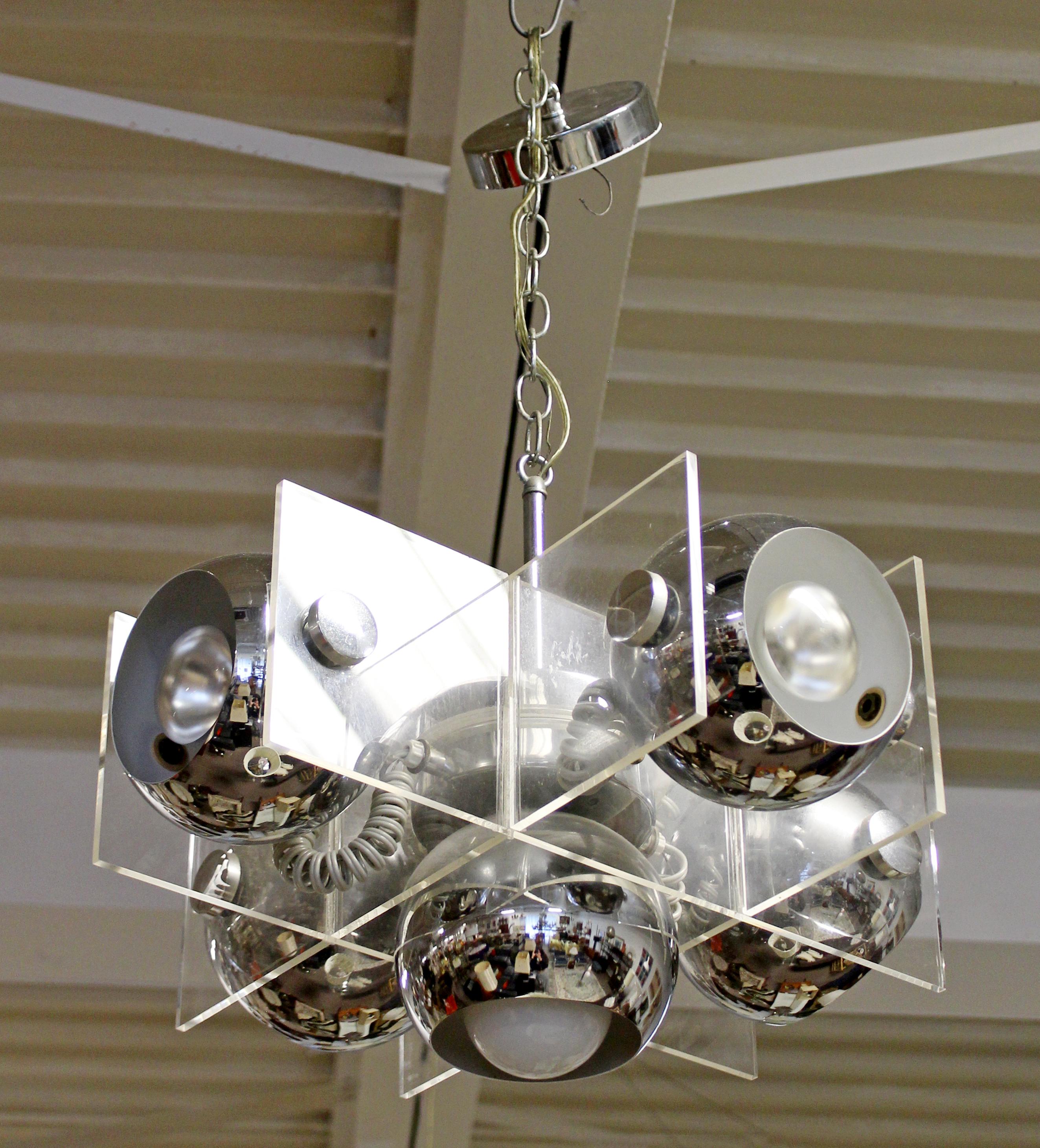 For your consideration is a funky, cubic chandelier, made of chrome and Lucite, circa 1970s. In excellent vintage condition. The dimensions are 18