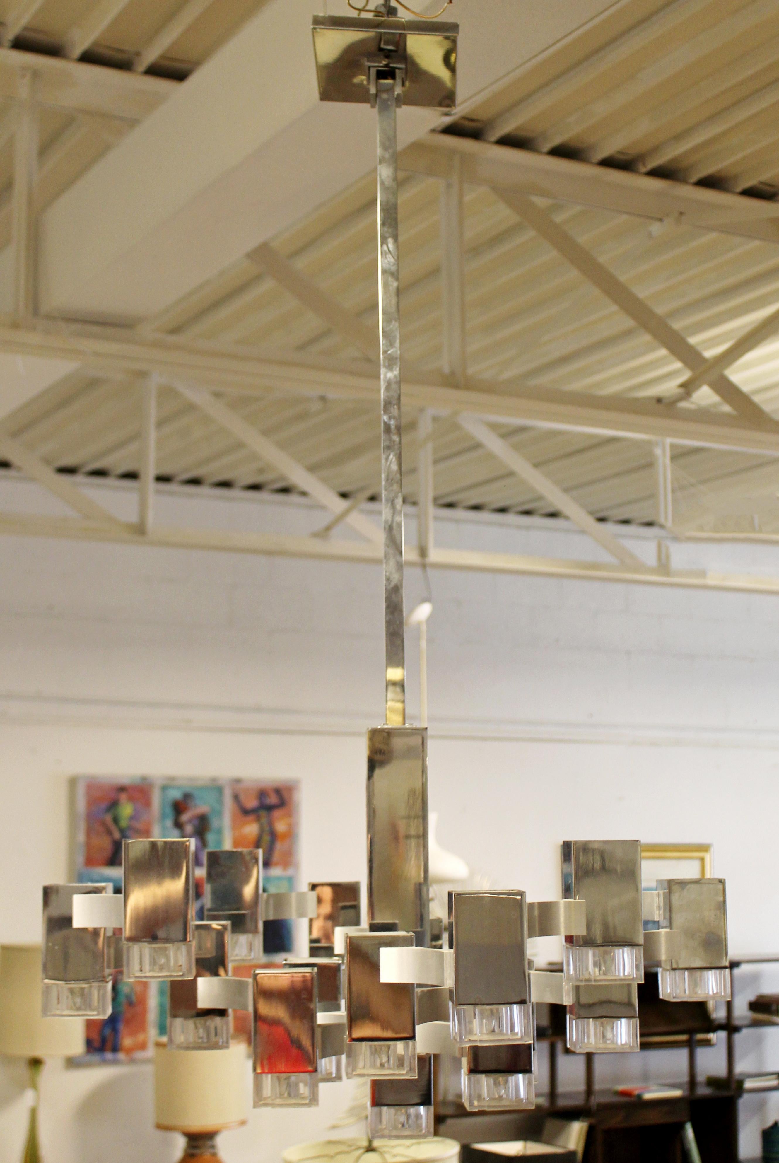 For your consideration is an incredible, cuboc chandelier, made of chrome and Lucite, by Sciolari for Lightolier, circa 1970s. In excellent vintage condition. The dimensions are 26