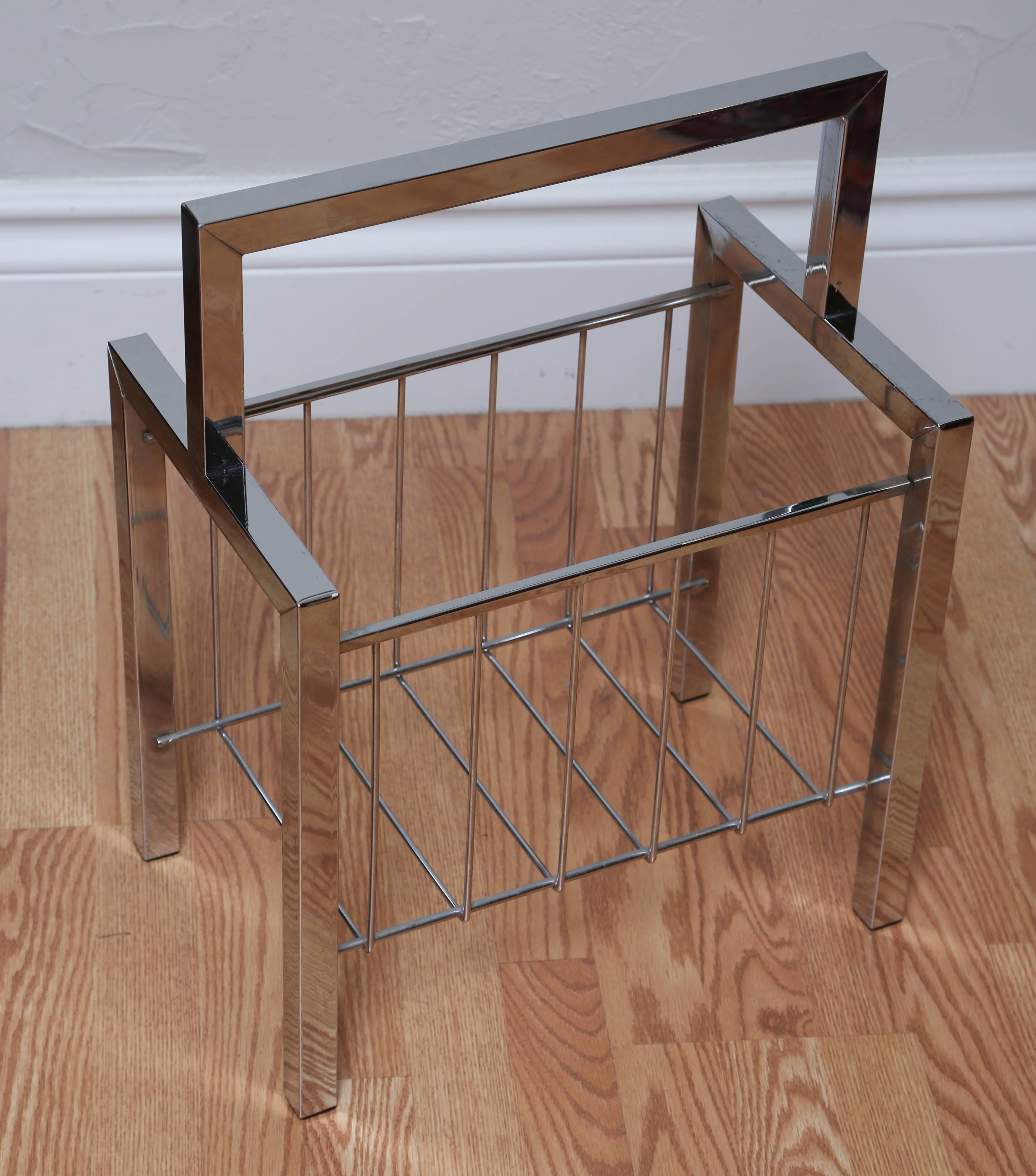 Polished chrome magazine holder by midcentury designer, Milo Baughman.