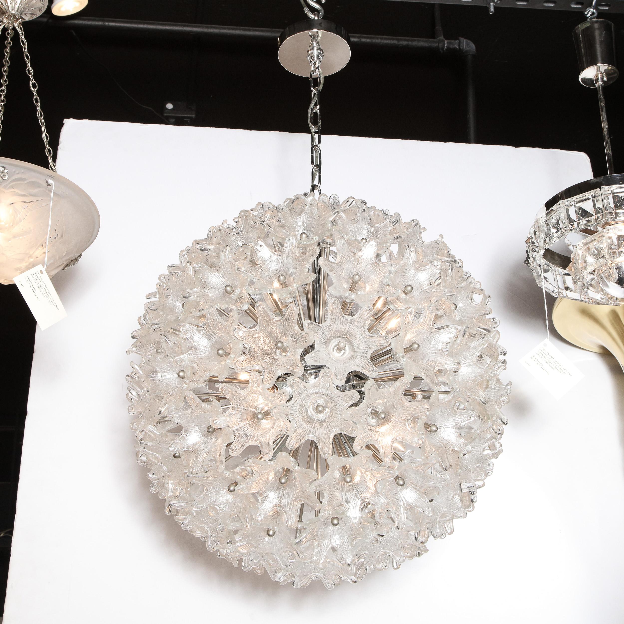 This graphic and refined Mid-Century Modern Sputnik chandelier was realized in Italy, circa 1970. Created in the manner of Rupert Nikoll, the chandelier features a chrome body with an abundance of stylized and abstracted floral shades in striated