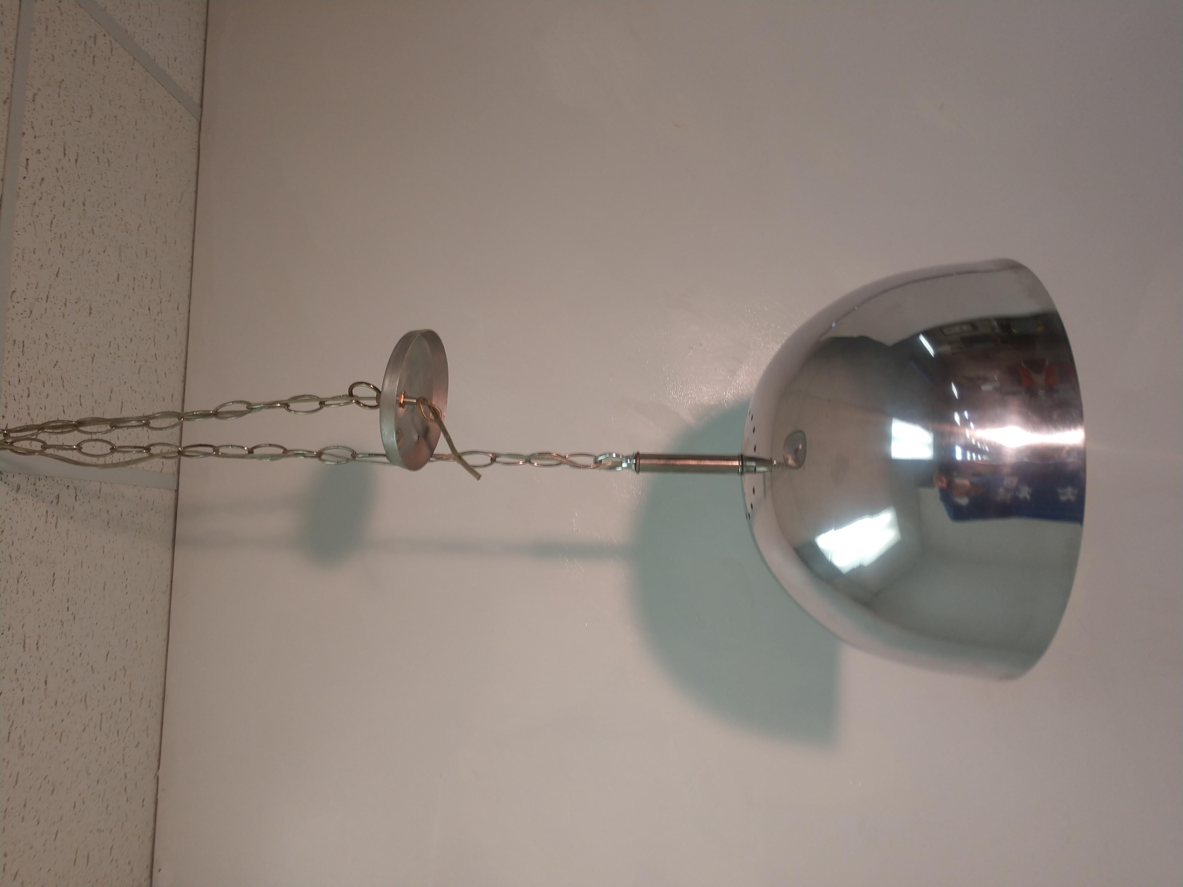 Chrome pendant lamp with milk glass ball diffuser.
Hanging lamp with adjustable chain to suit your desired height, 36 inches of chain, fixture is 17 in hgt. x 15.75 diameter. Chrome has a minor blemish, last pic. Aluminum canopy. Wiring is sound.