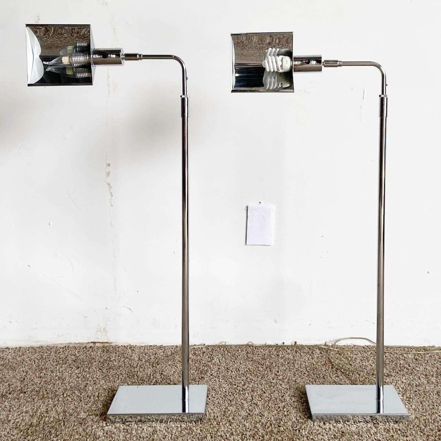 Exceptional pair of vintage mid century modern pharmacists lamps. Each feature a chrome finish.

Extends from 34.5” to 45.5” in