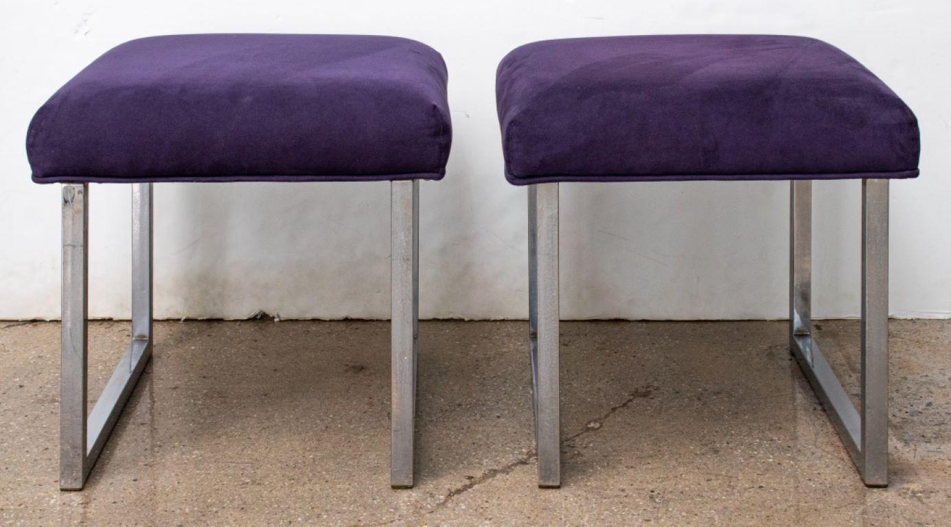 Pair of Mid-Century Modern chromed metal stools or ottomans with purple ultrasuede upholstered seats, in the manner of Milo Baughman (American, 1923-2003). 

Dealer: S138XX