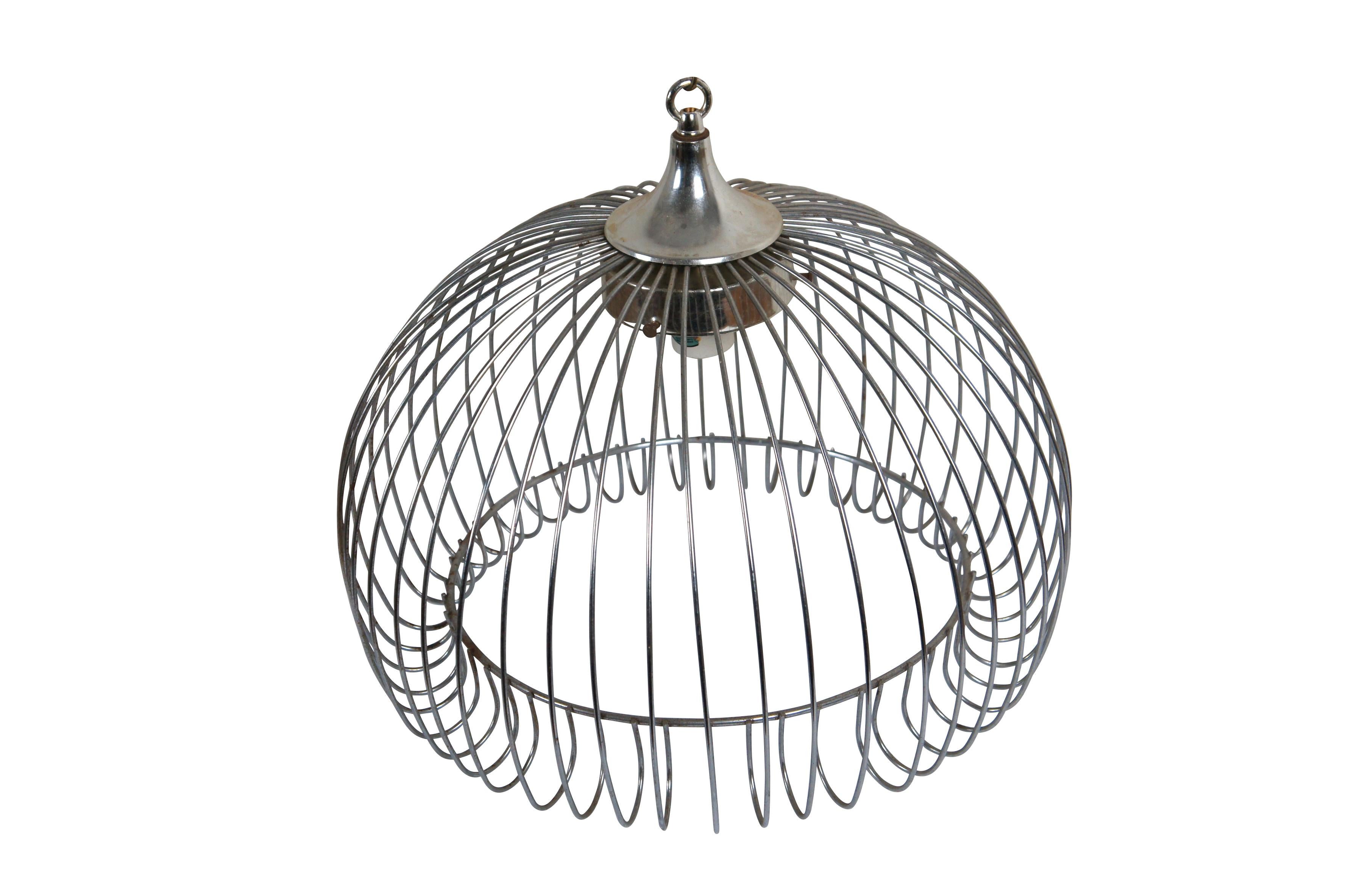 Mid 20th century chrome bird cage style swag / pendant light. Round cage form with curled in lower edge. Missing globe shade. Plug in. Gold tone chain.

Dimensions:
16.5
