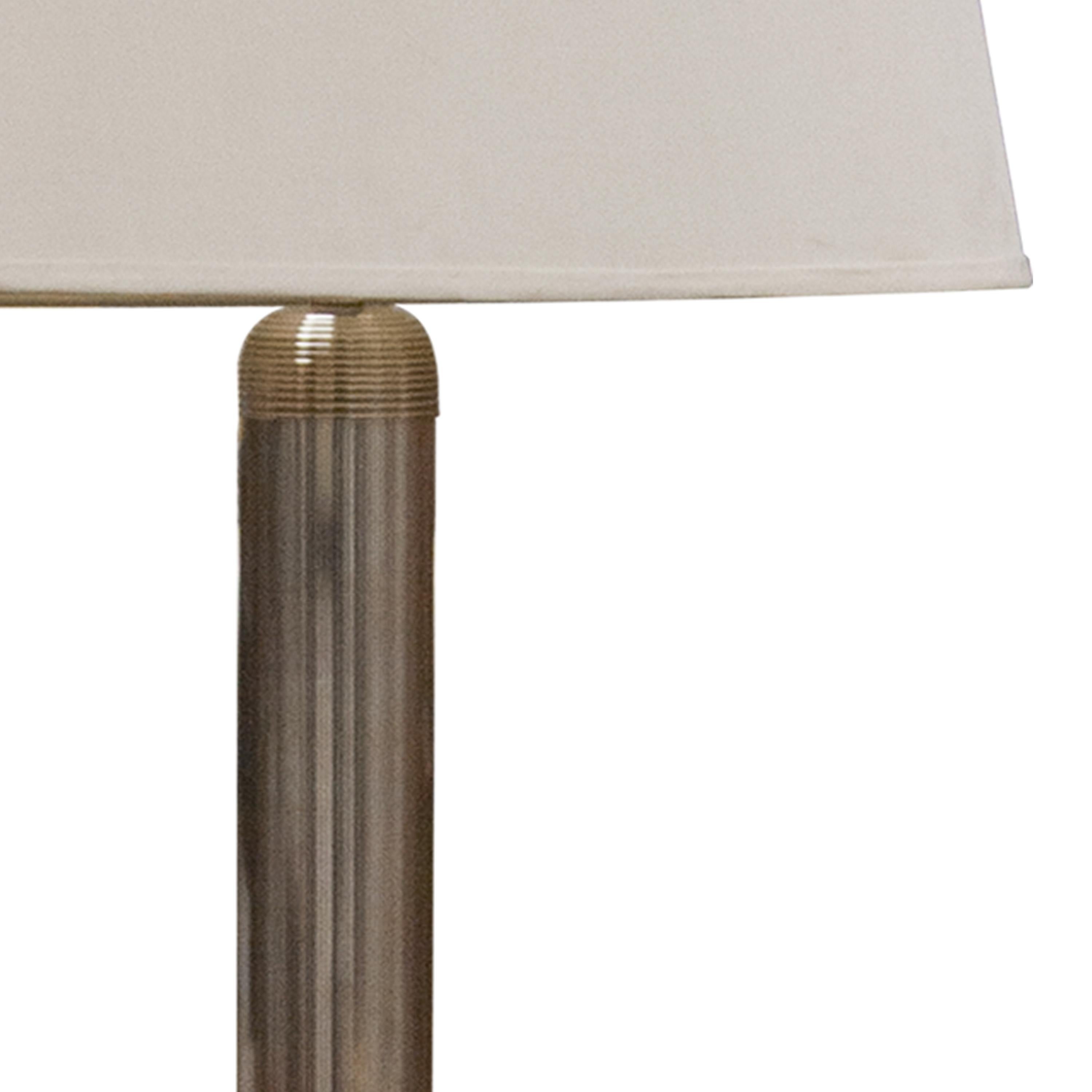 Italian chromed floor lamp with elegant galloned work and white shade.