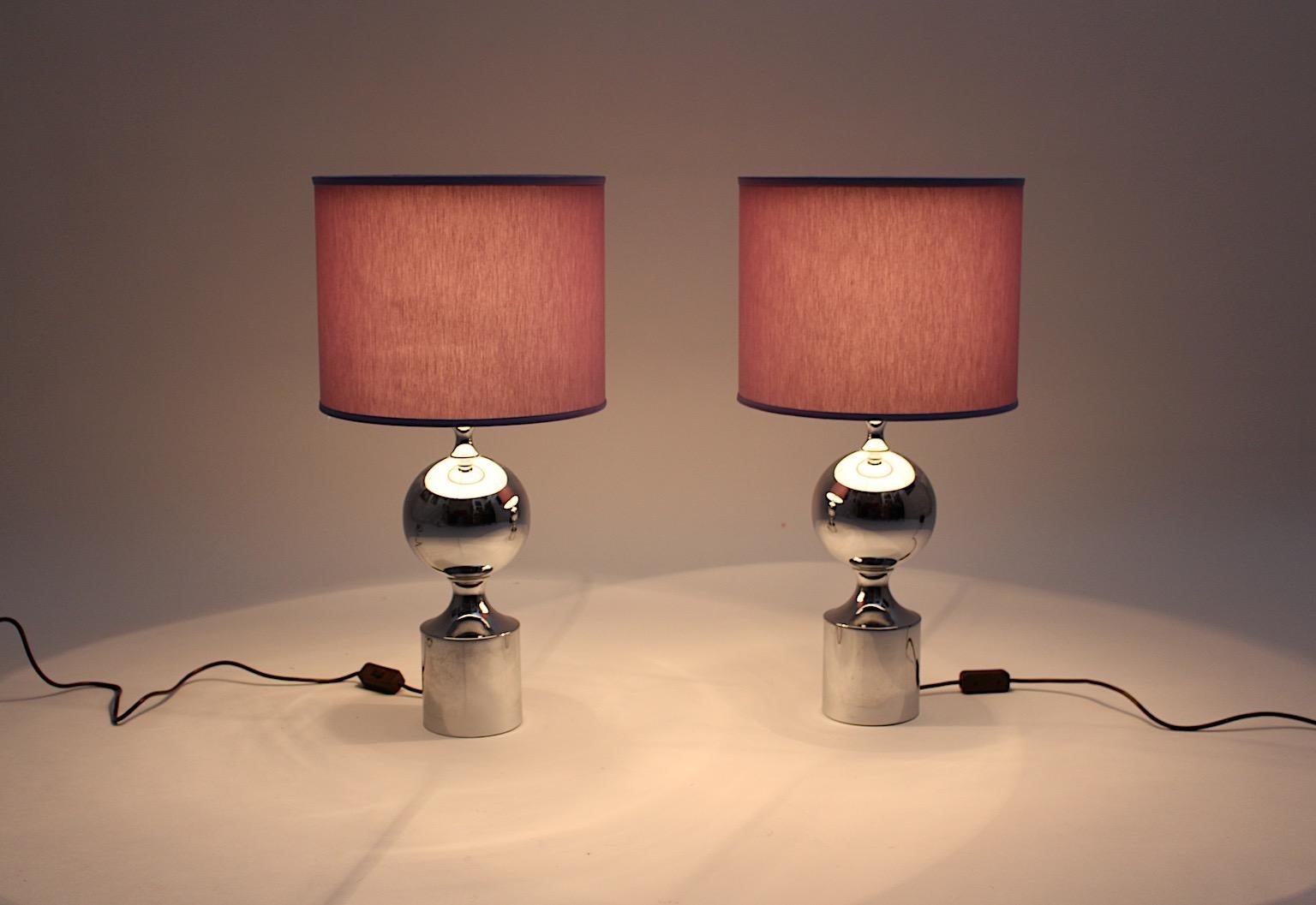 A pair of Mid-Century Modern chromed vintage table lamps with renewed lavender colored chintz fabric shades.
The elegant and sophisticated combination of chromed color and lavender color is very beautiful and a classical favorite and is one of the