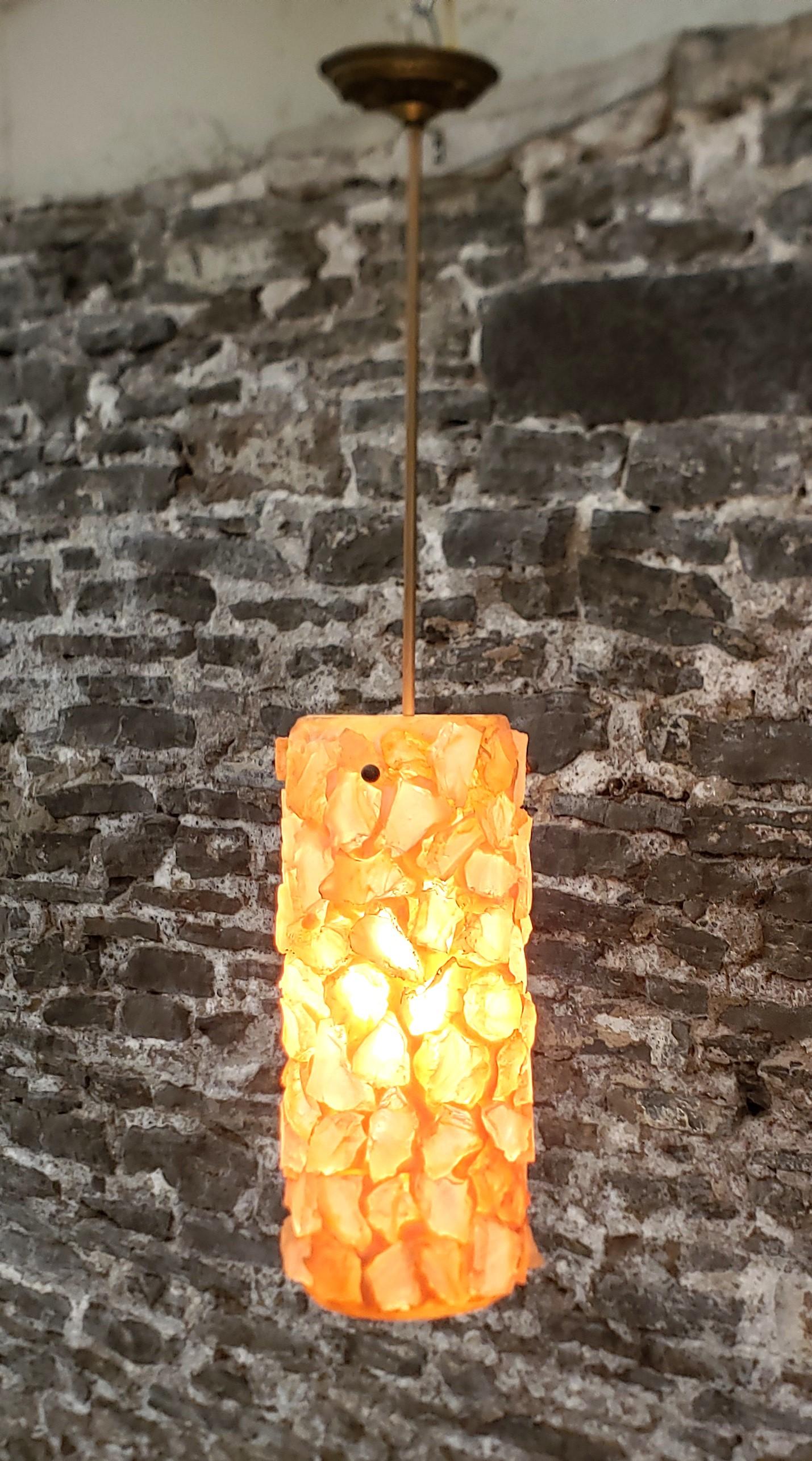 American Mid-Century Modern Chunky Rock Peach Lucite Pendant Light with Brass Accents For Sale