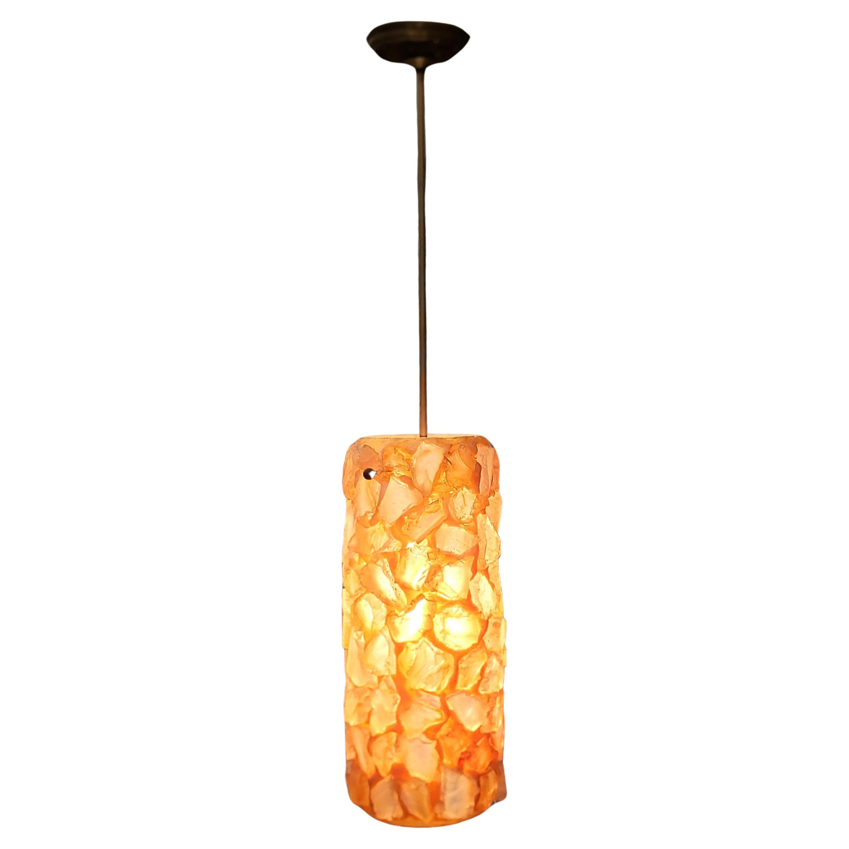 Mid-Century Modern Chunky Rock Peach Lucite Pendant Light with Brass Accents For Sale