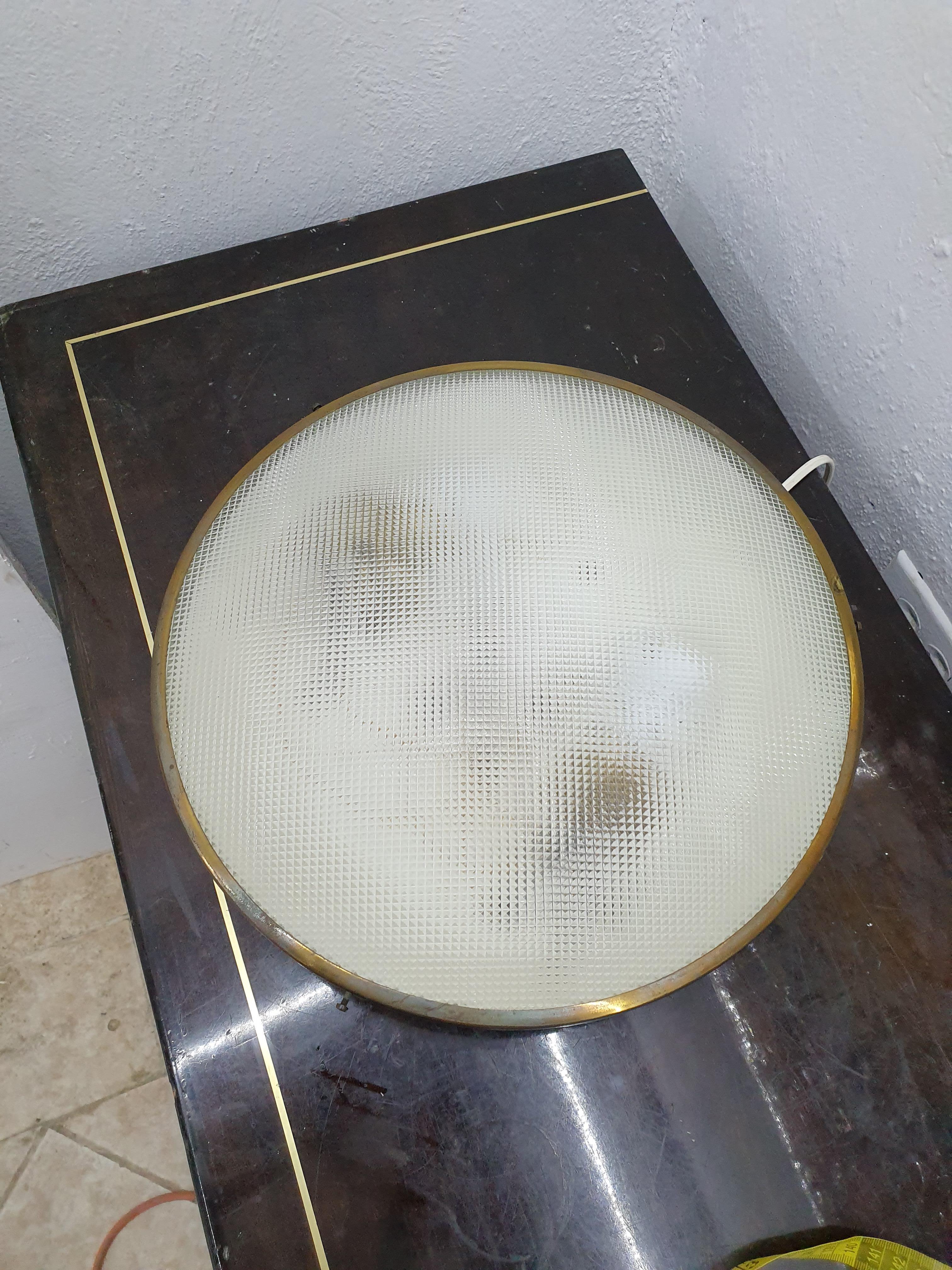 Two light, wall or flush mount lamp in brass, white aluminum body and frosted glass in the manner of Gino Sarfatti for Arteluce, Italy, circa 1950.
The brass has been polished and the lamp has been carefully restored.

