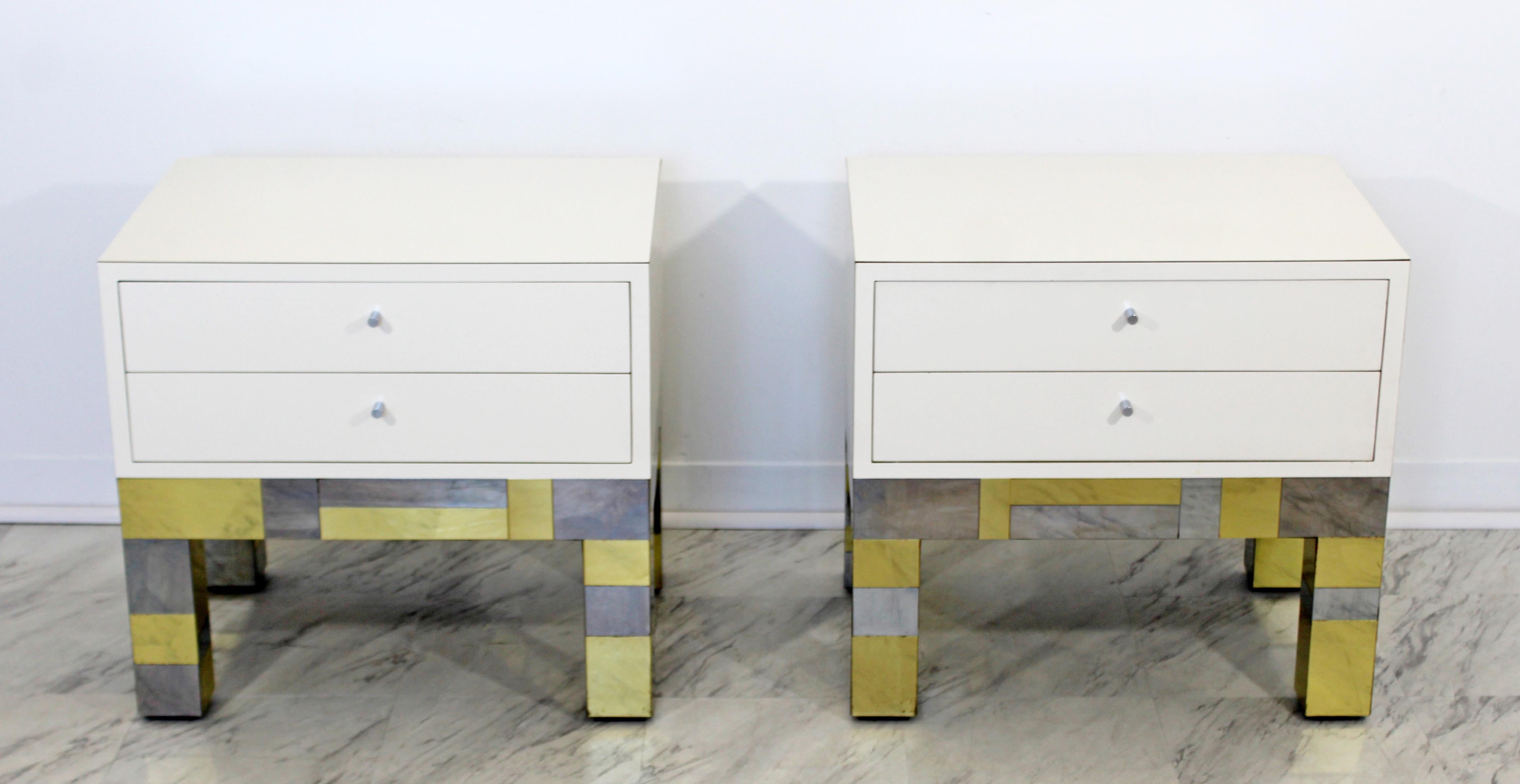 For your consideration is a phenomenal pair of cityscape nightstands, made of patchwork chrome and brass, with two shelves each, signed by Paul Evans for Directional, dated 1973. In good vintage condition. The dimensions are 24