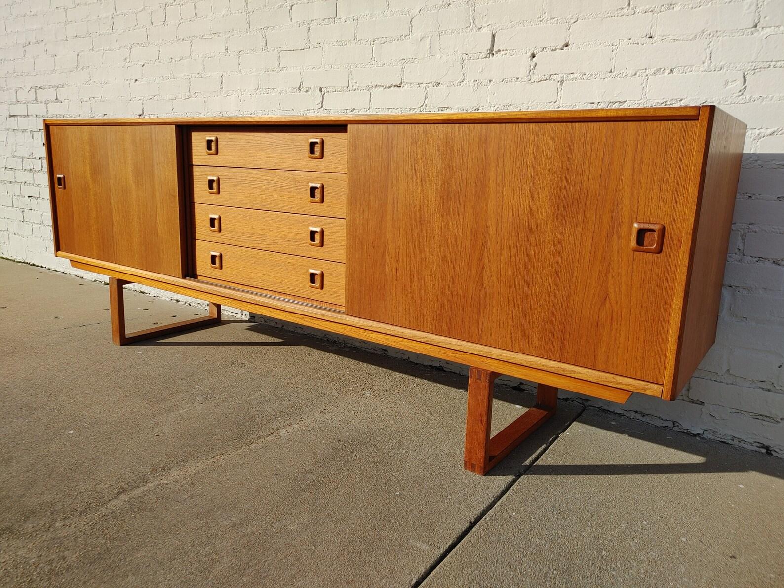 Mid Century Modern Clausen & Son Teak Sideboard

Above average vintage condition and structurally sound. Has some expected slight finish wear and scratching.

Additional information:
Materials: Teak
Vintage from the 1960s
Dimensions: 82 W x 18  D x